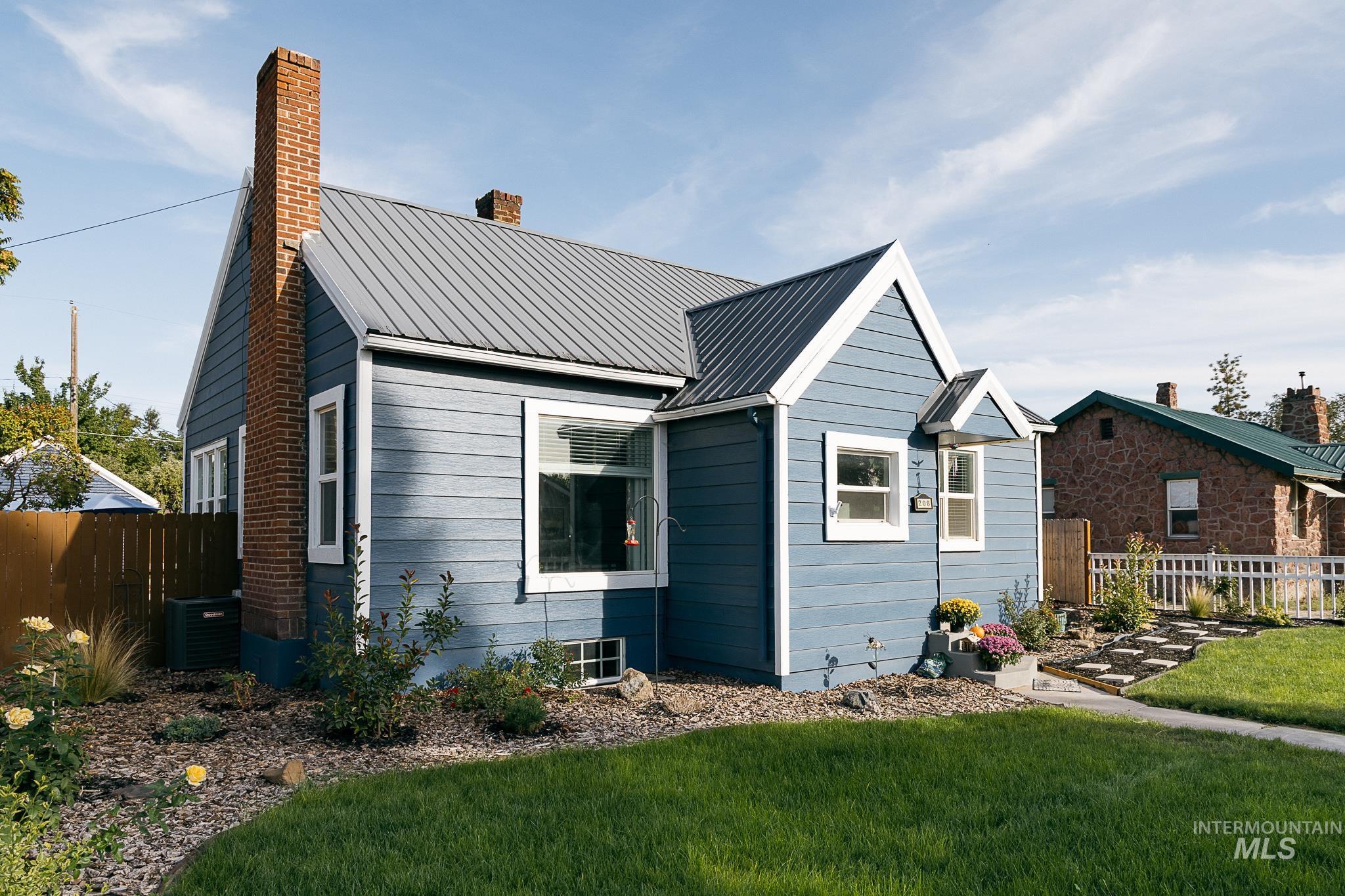 Bungalow-style house with a metal roof