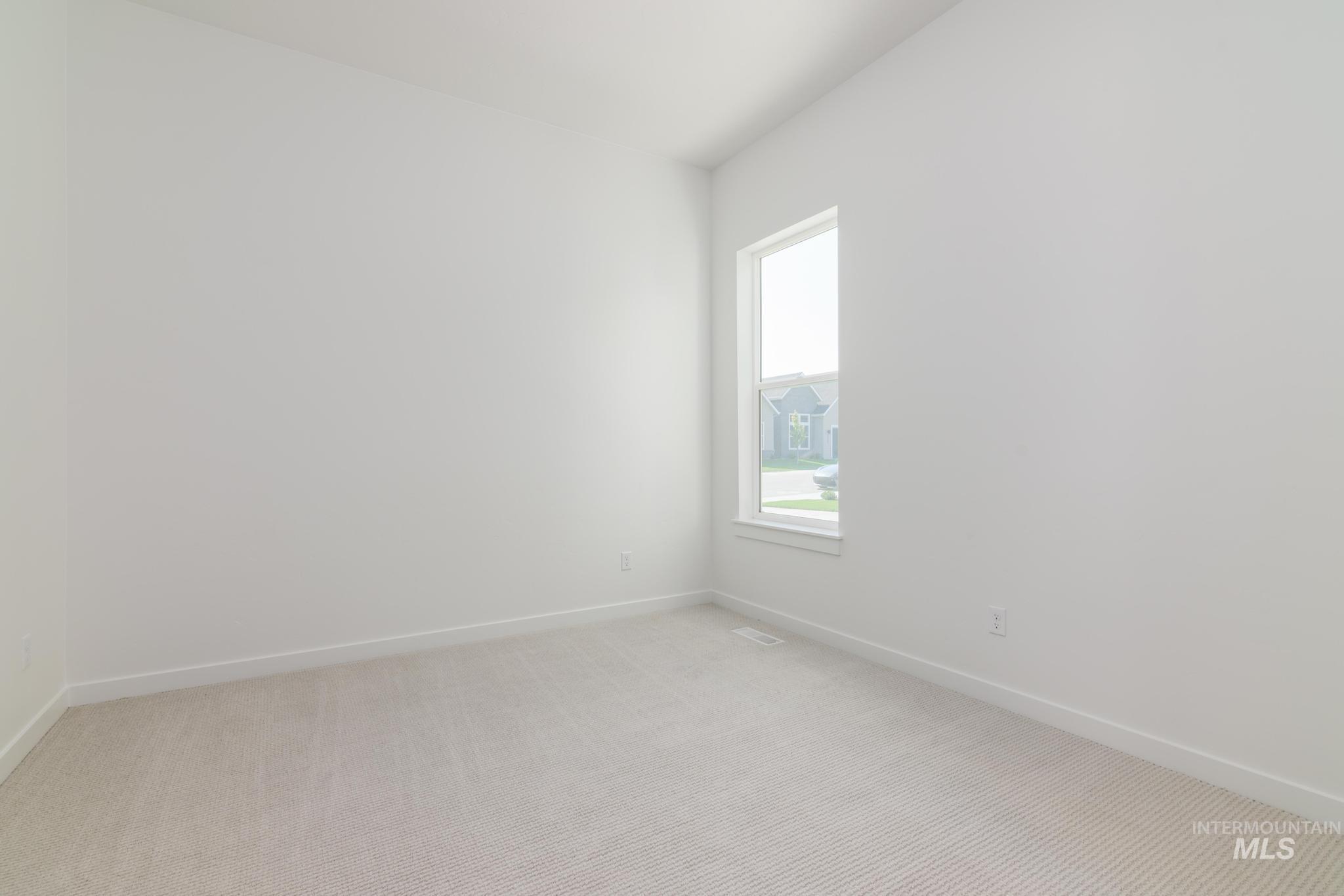 Unfurnished room featuring carpet flooring and baseboards