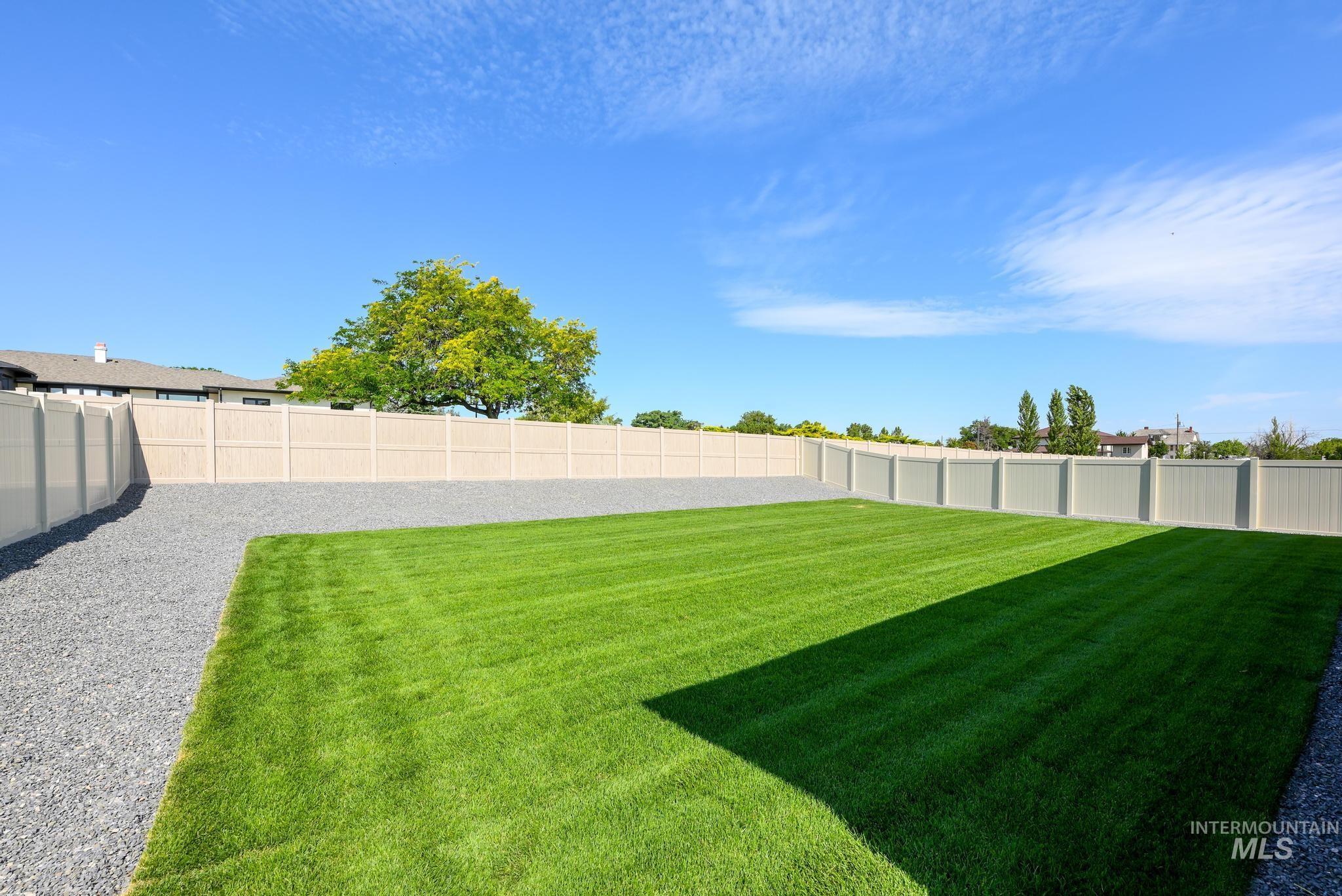 View of fenced backyard
