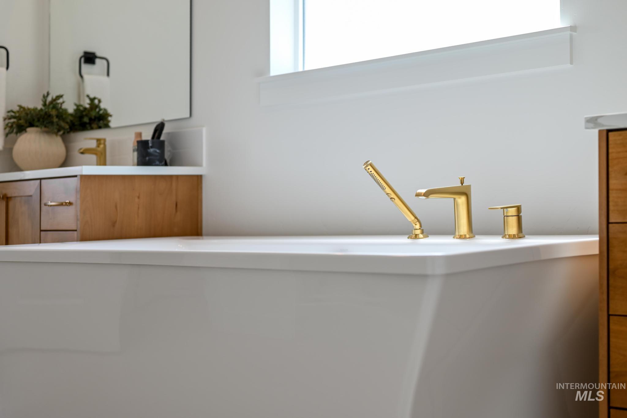 Bathroom view of a freestanding bath and vanity