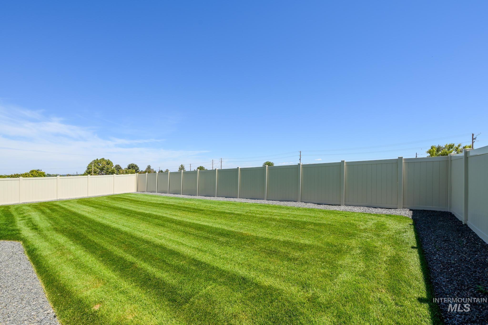View of fenced backyard