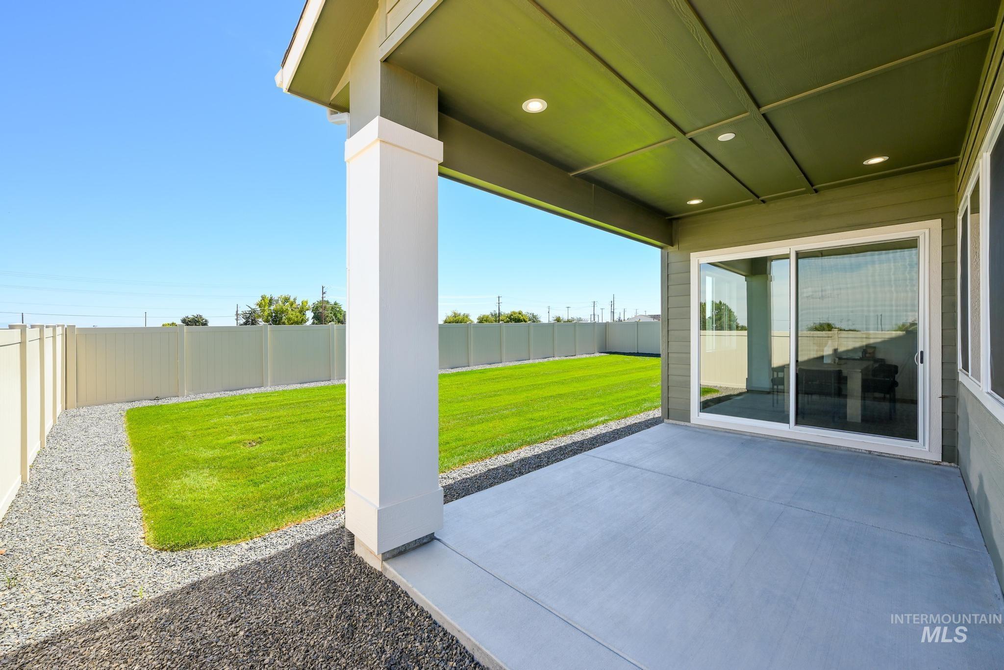 Fenced backyard featuring a patio area