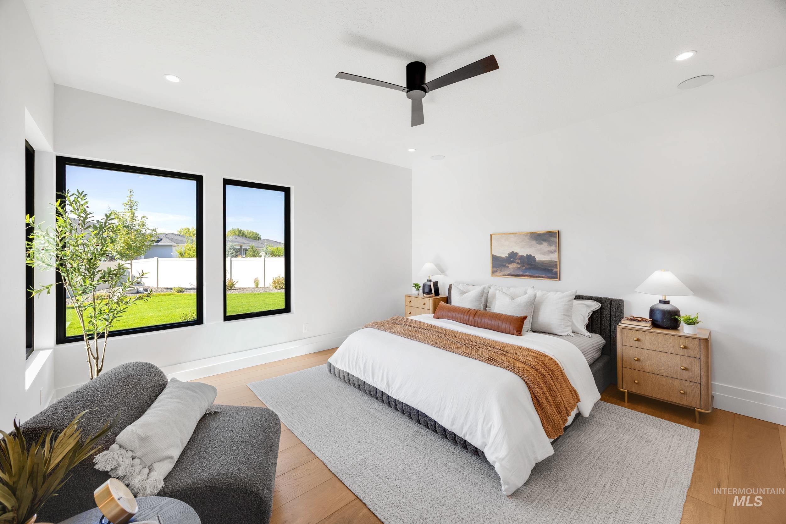 Bedroom featuring recessed lighting, light wood-style floors, and ceiling fan