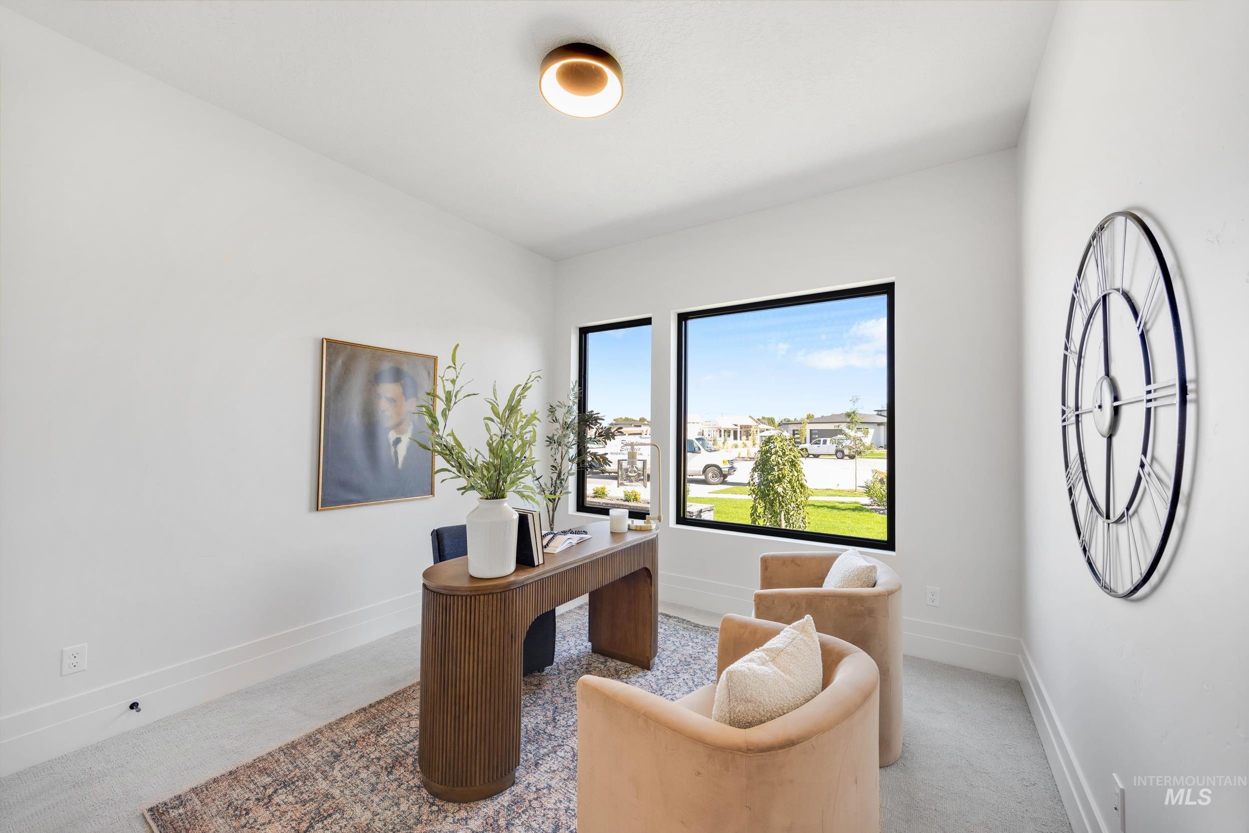 Home office with baseboards and carpet flooring