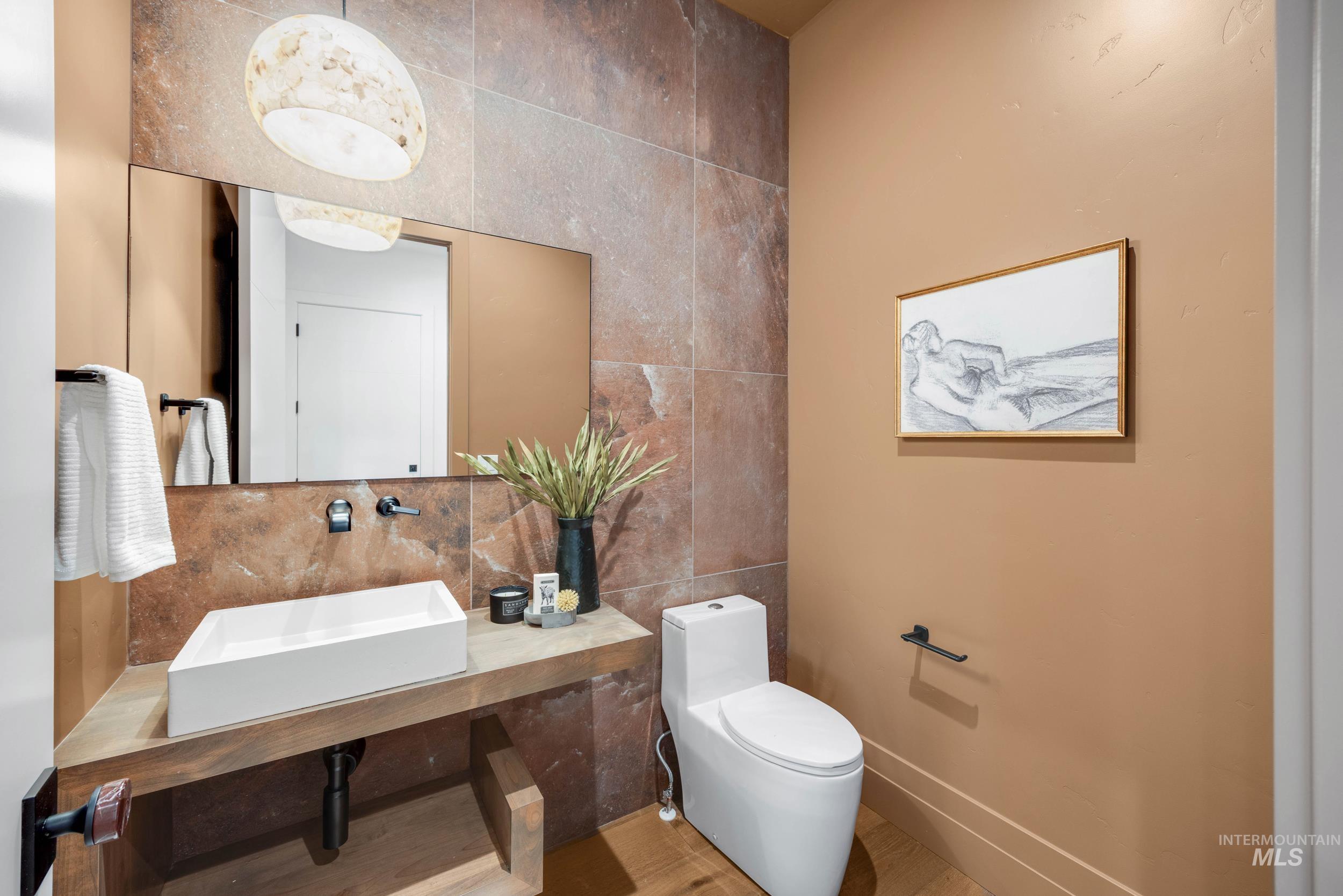 Bathroom featuring tile walls and backsplash