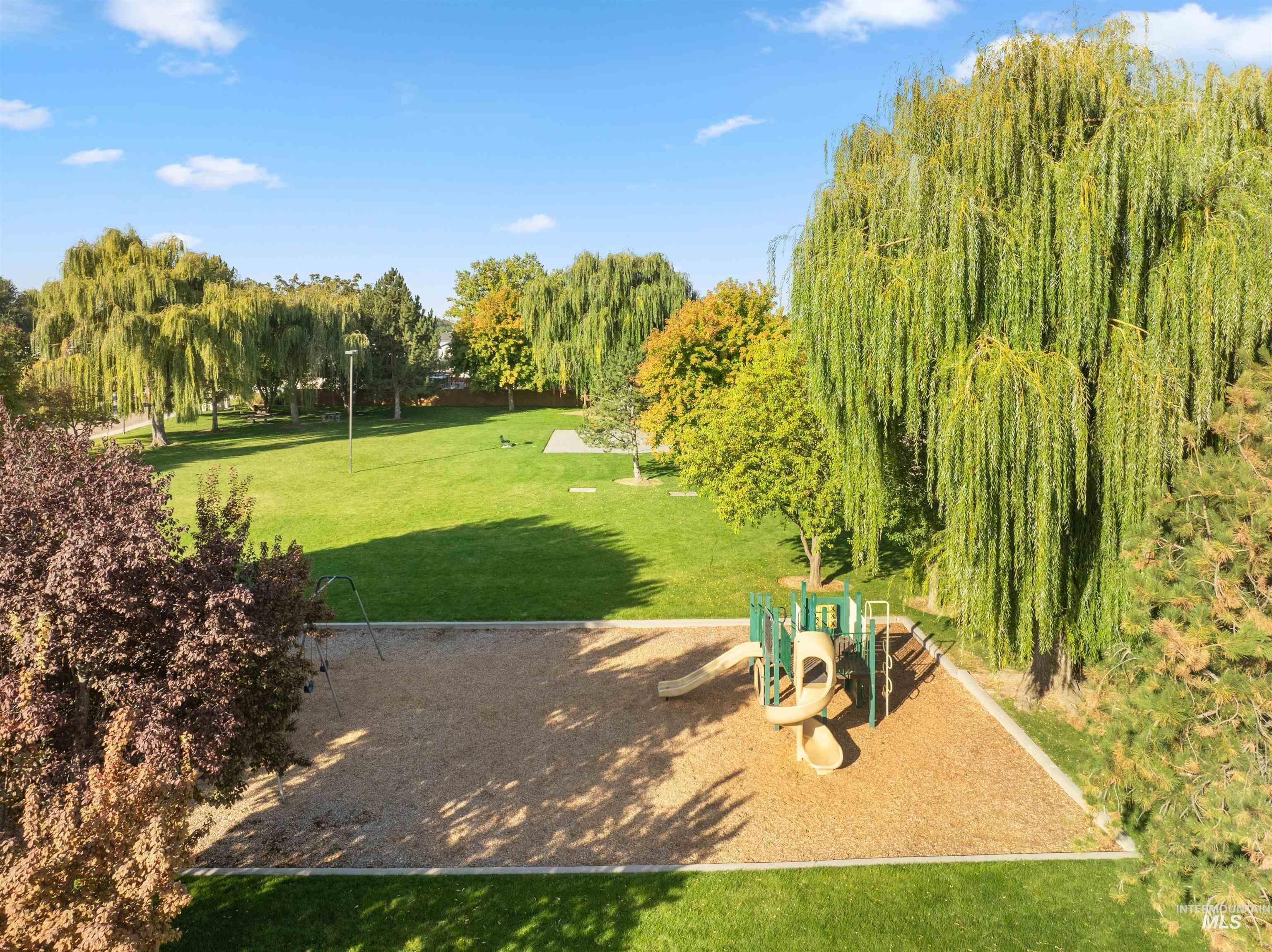 View of property's community featuring a yard