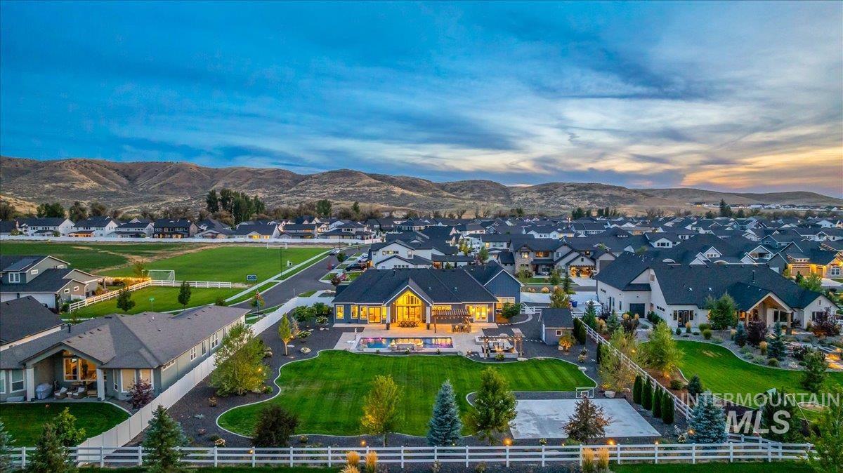 Aerial view at dusk of a residential view and a mountain view