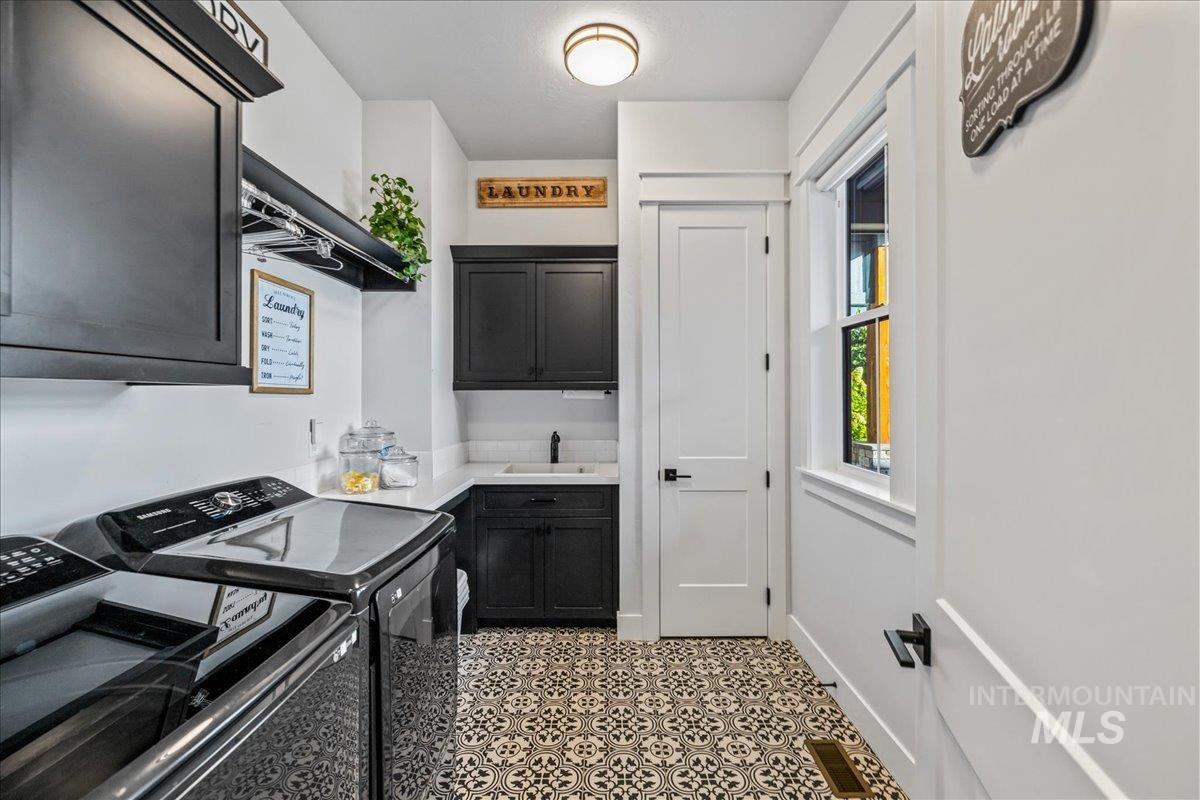Laundry area with cabinet space and washer and dryer