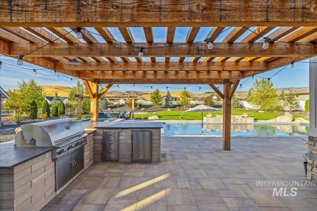 View of patio / terrace featuring a pergola and area for grilling