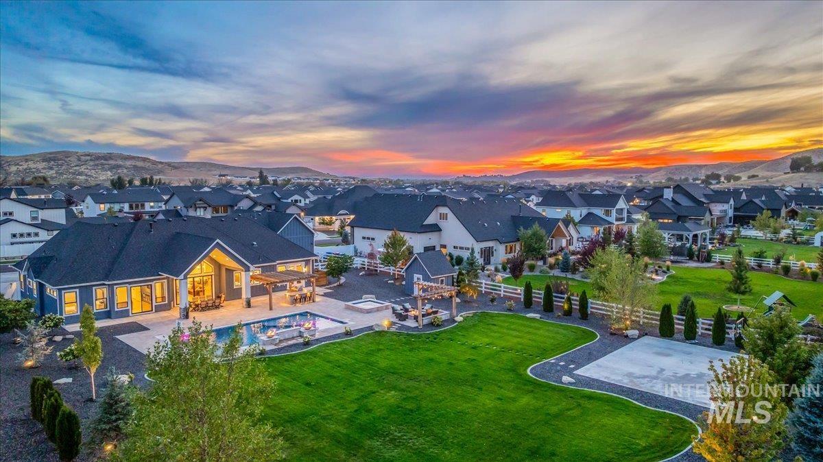 Aerial view at dusk of a residential view and a mountain view