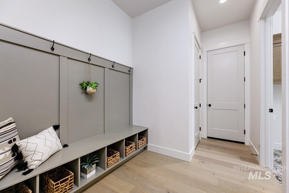 Mudroom with light wood-style floors and recessed lighting
