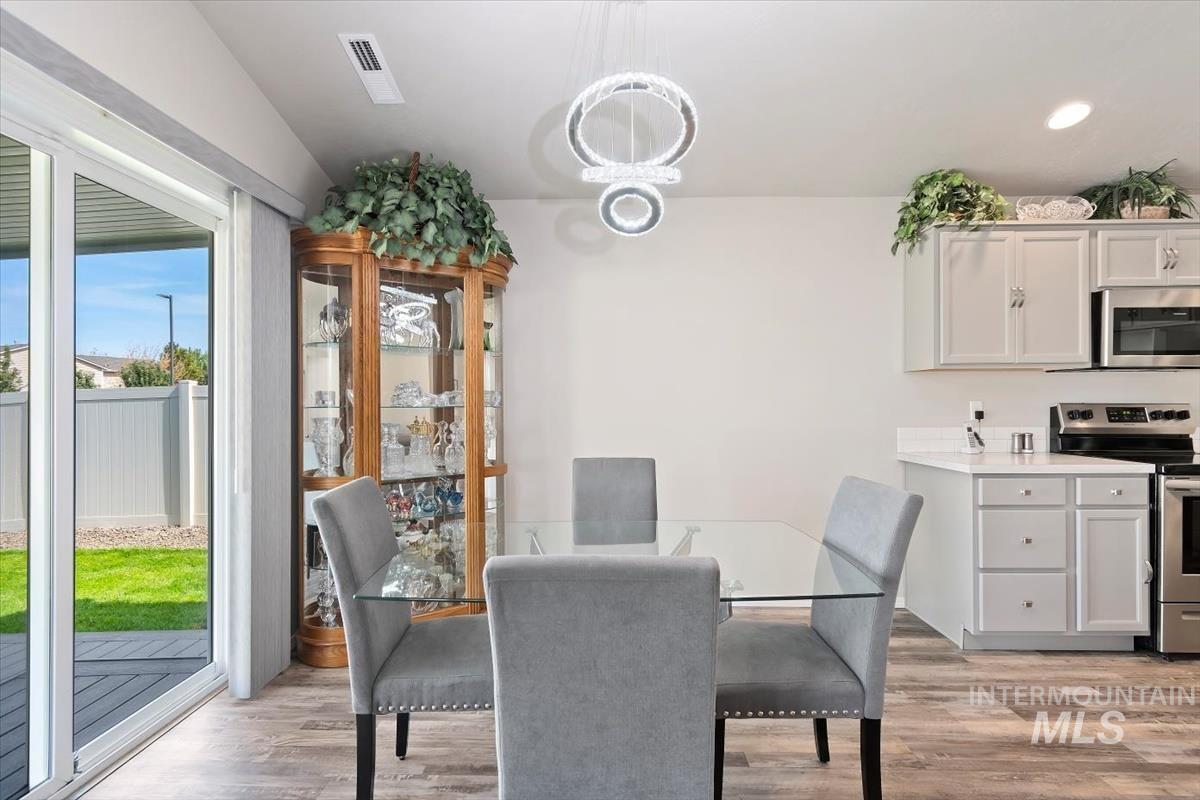 Dining space featuring light wood-style floors and recessed lighting