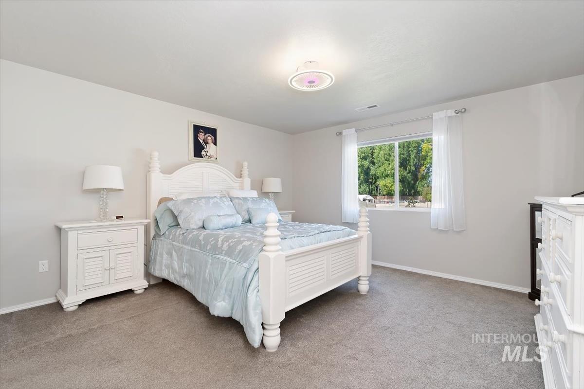 Bedroom with light carpet