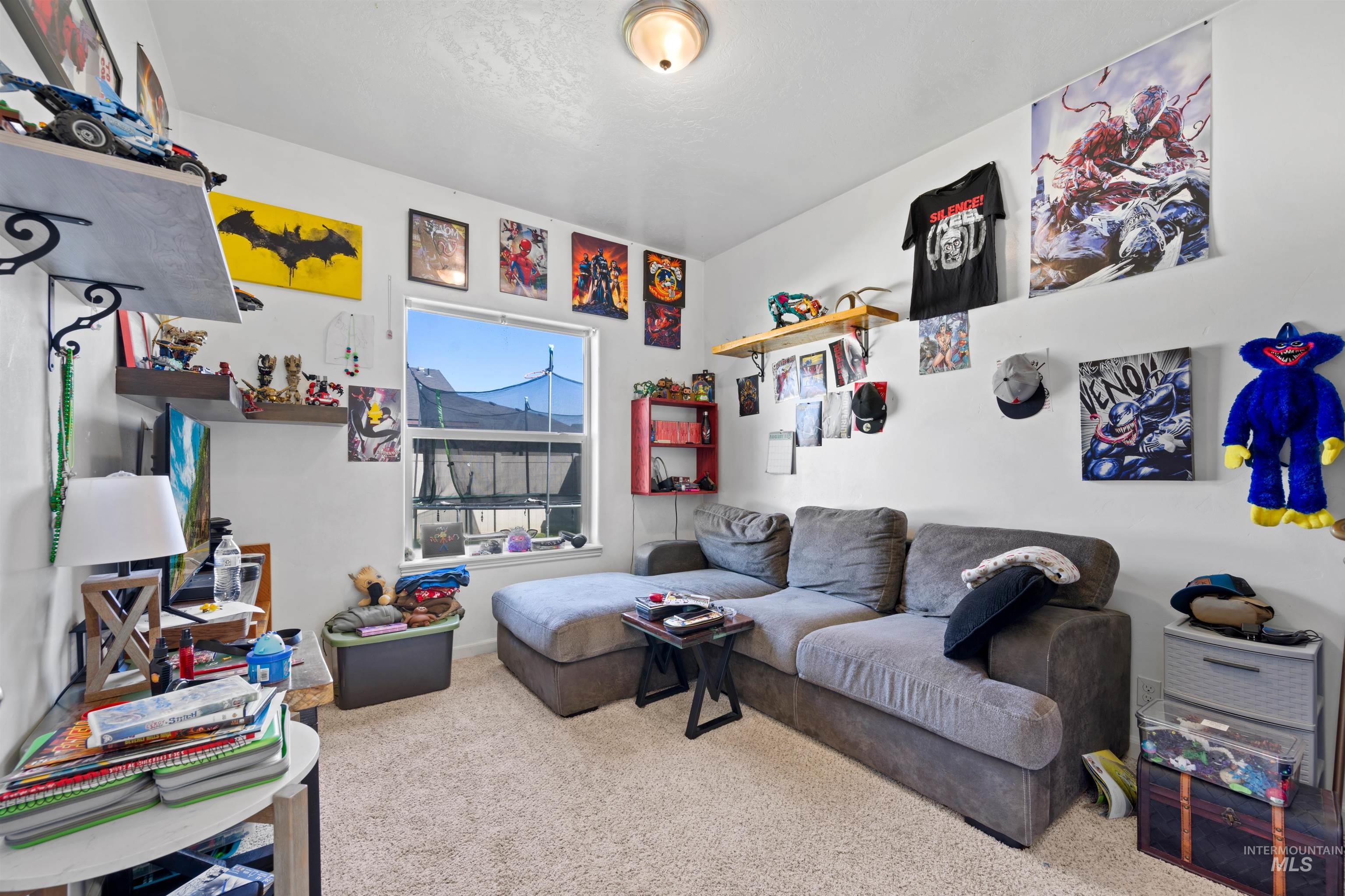 Carpeted living room with baseboards