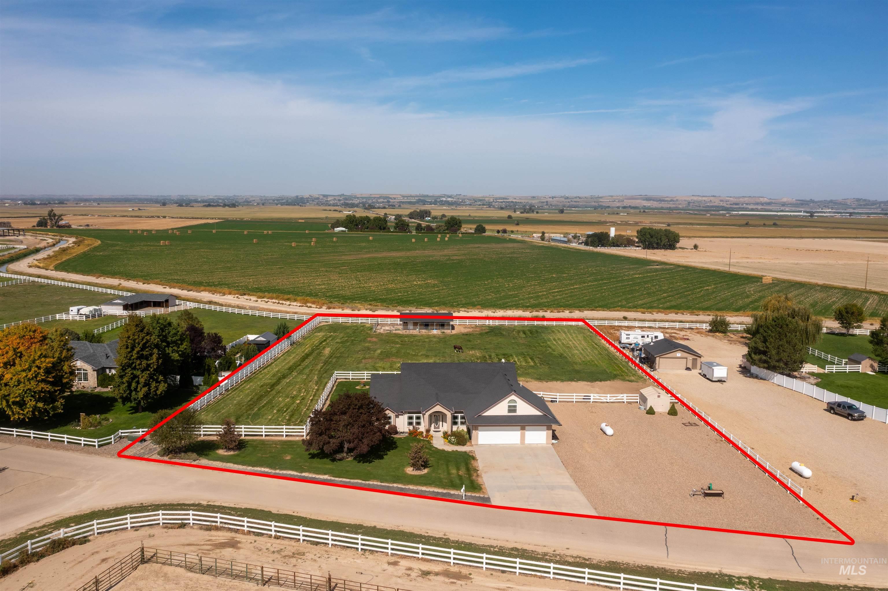 View of rural area featuring property boundaries highlighted and large plots for crops