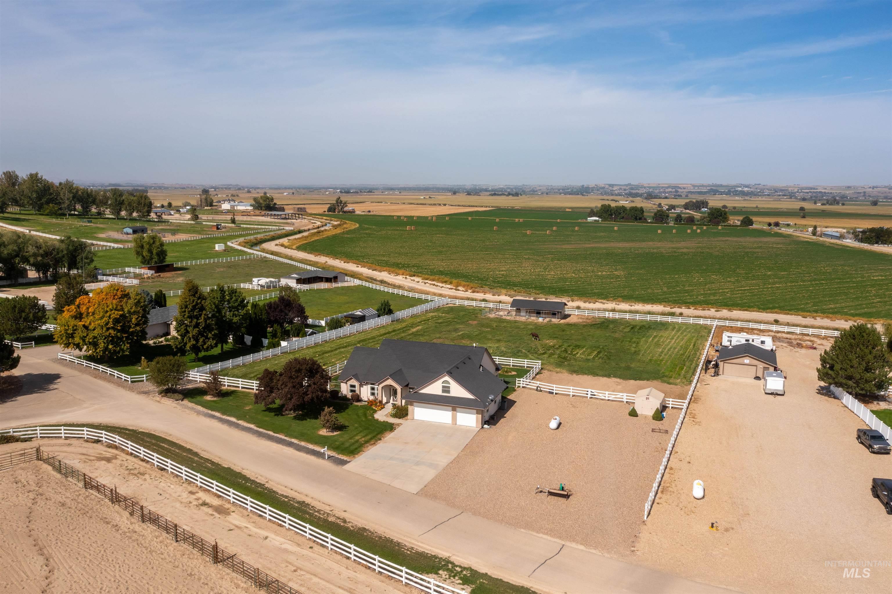 Aerial view of sparsely populated area featuring large plots for crops