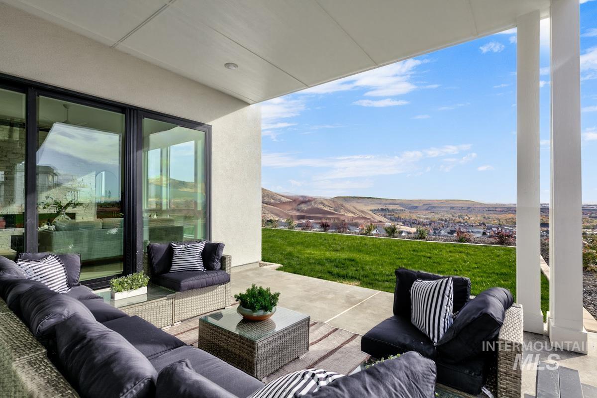 View of patio featuring outdoor lounge area and a mountain view