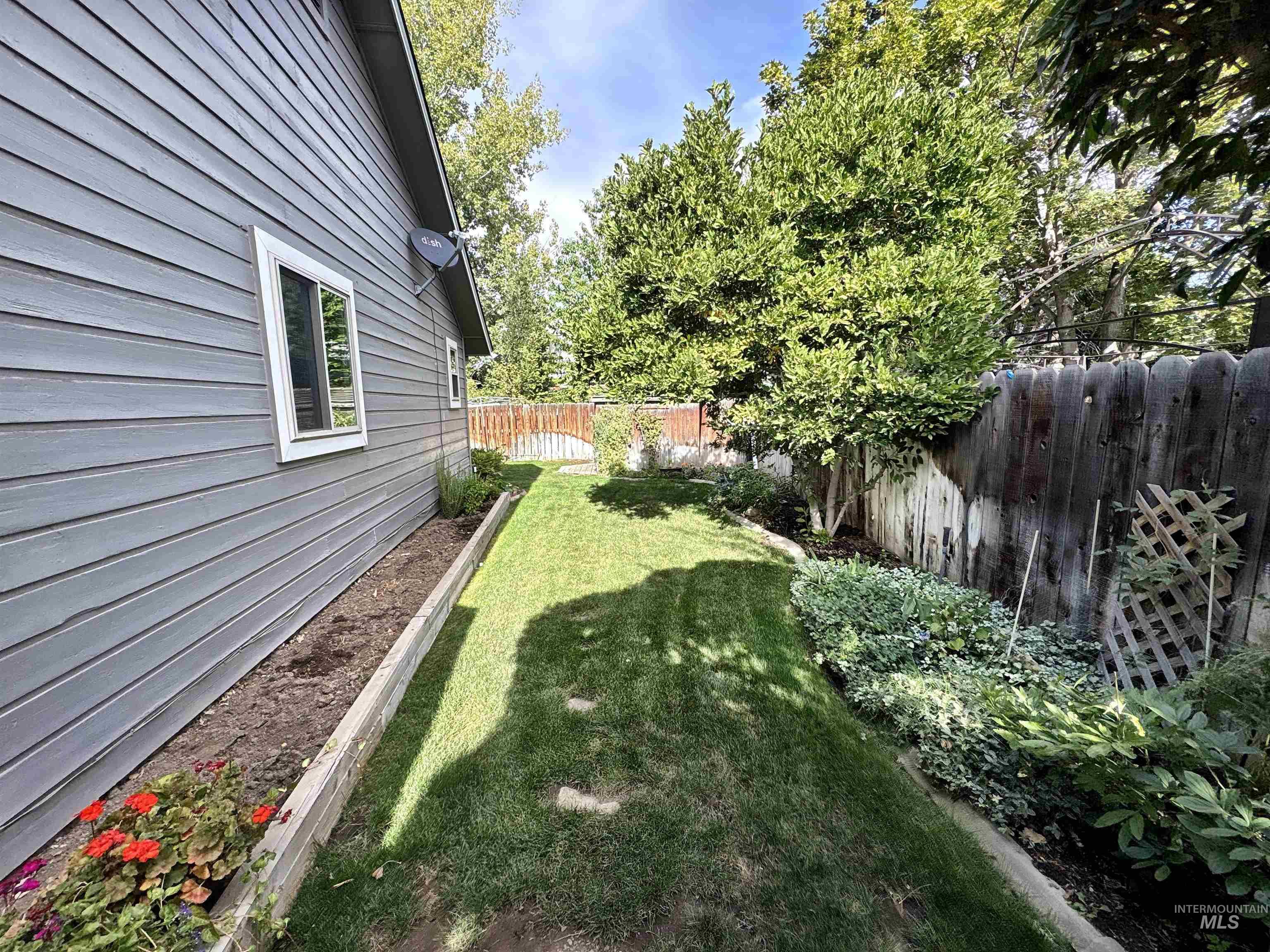 View of fenced backyard