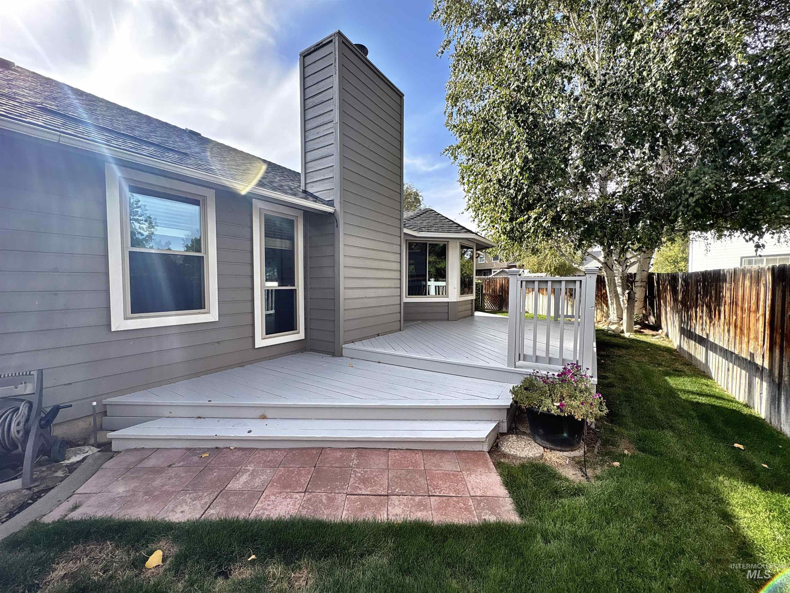 Deck with a fenced backyard