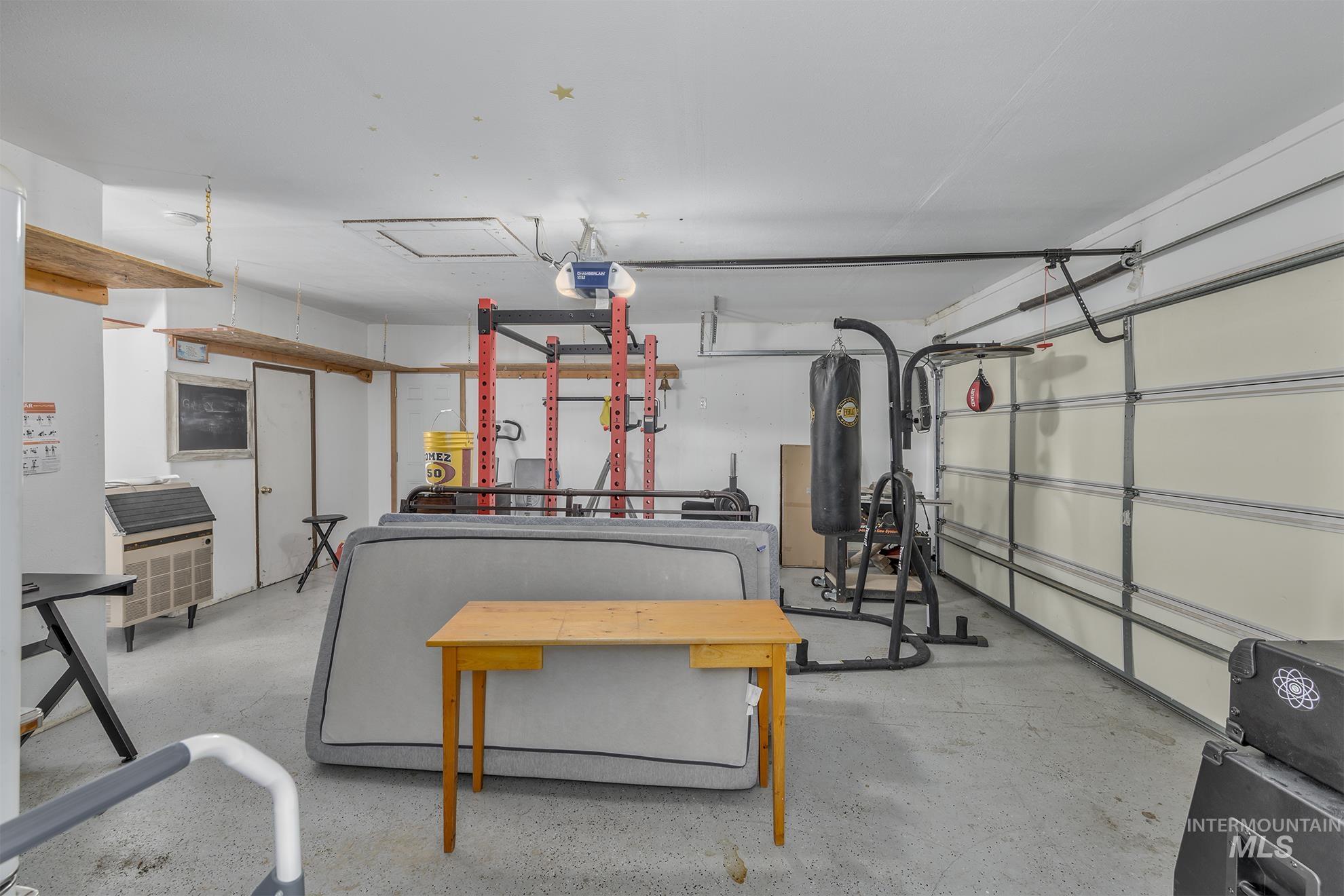 Garage featuring a garage door opener