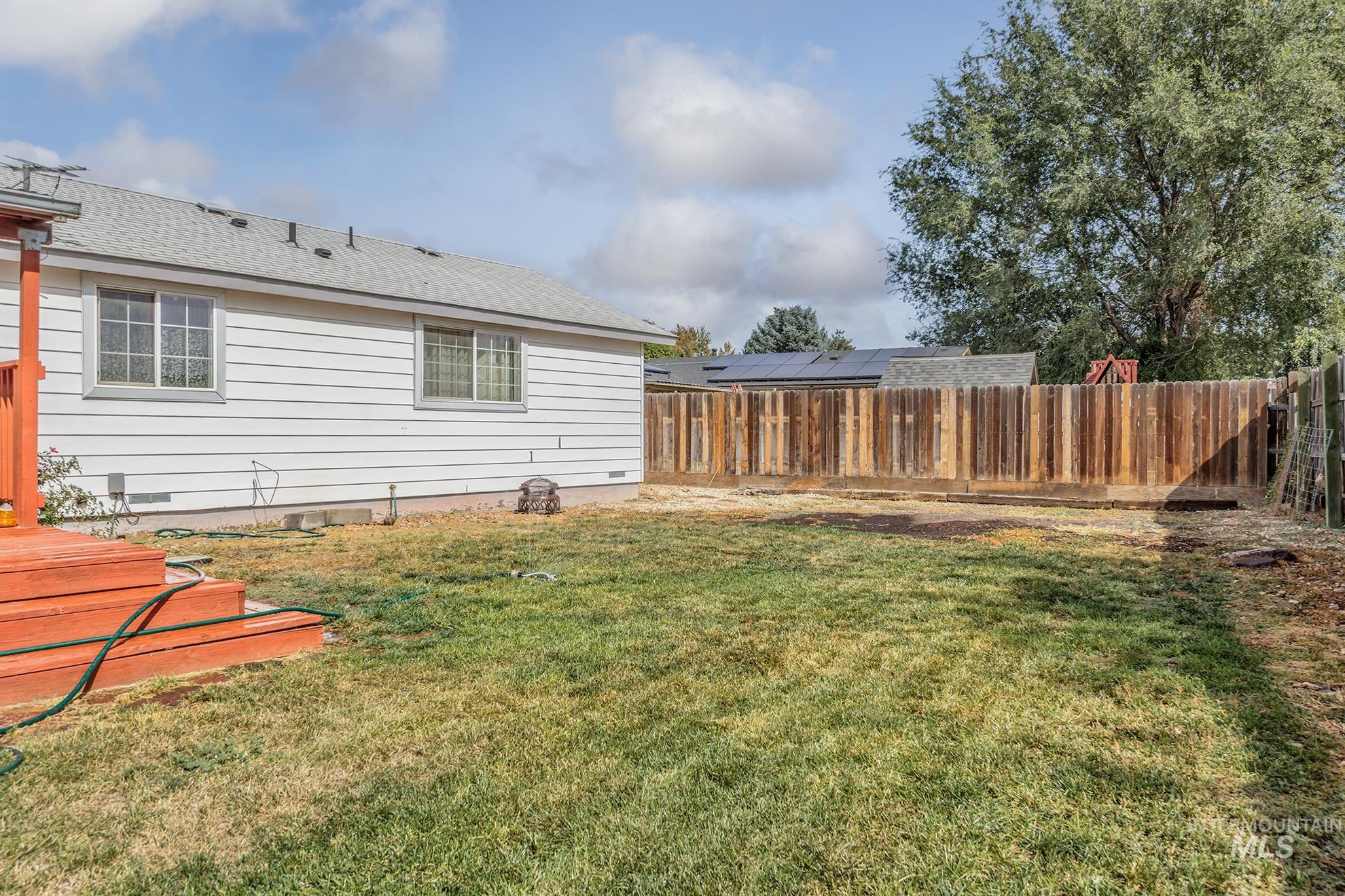 View of fenced backyard