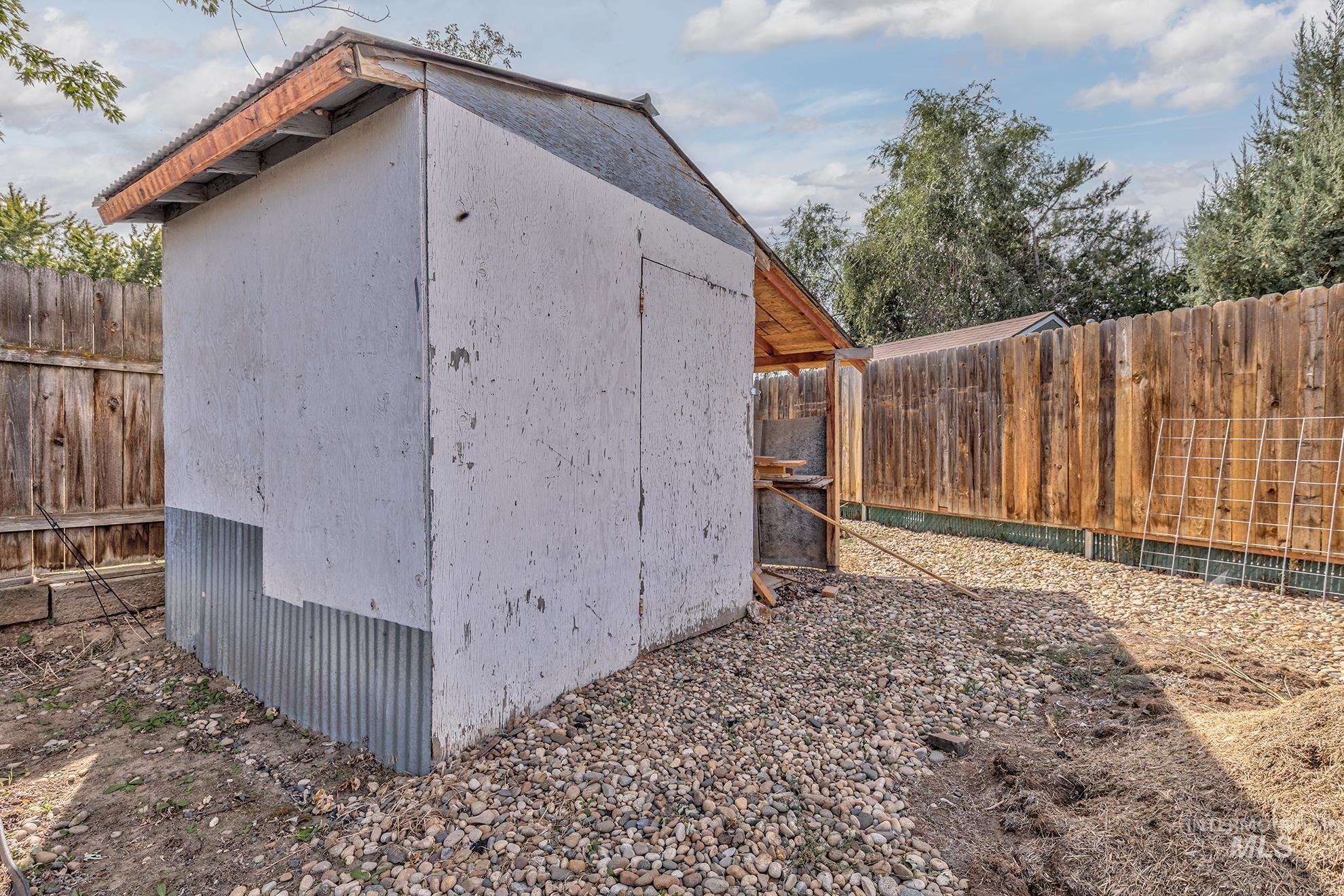 View of shed featuring a fenced backyard