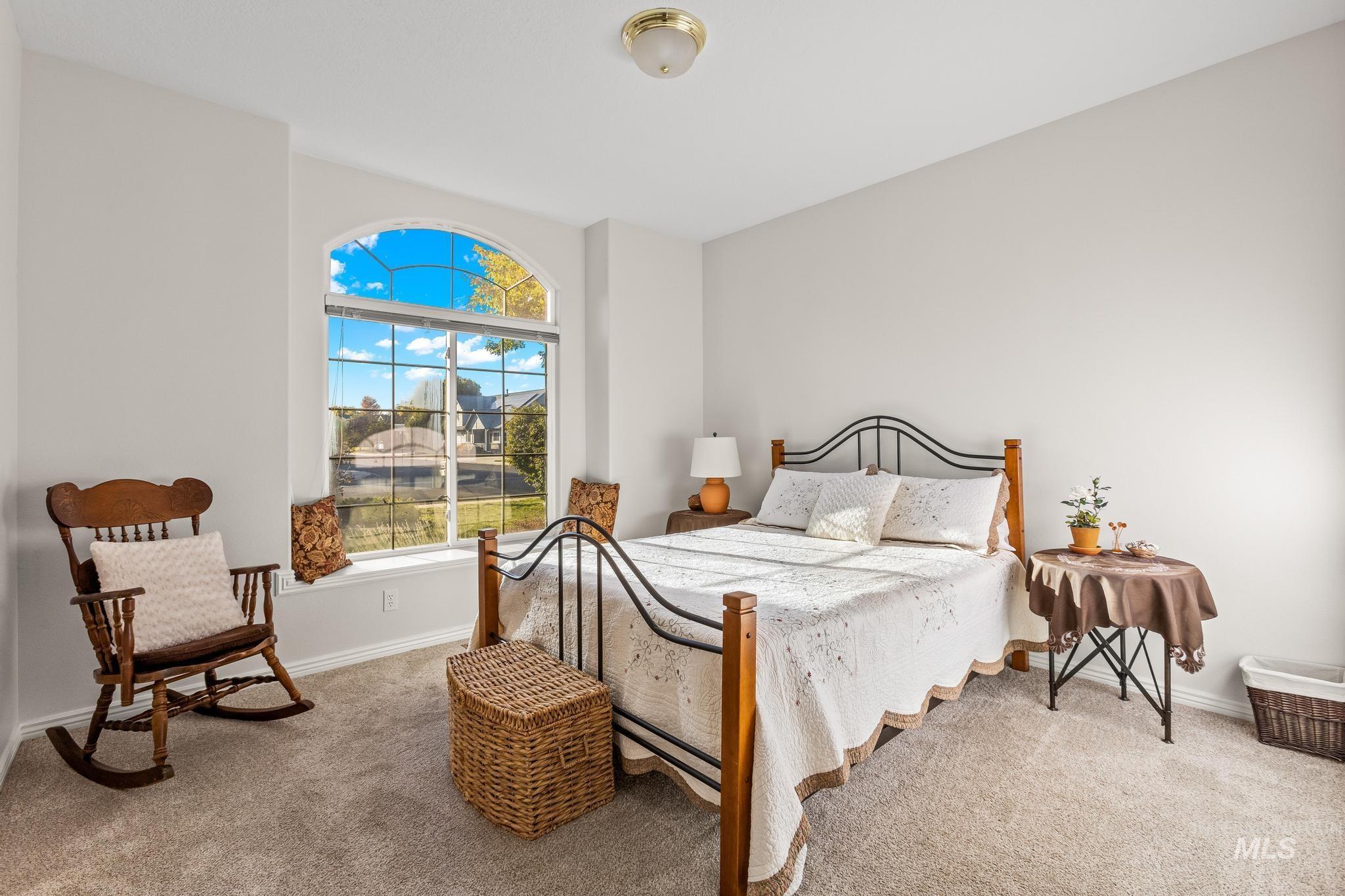Carpeted bedroom with baseboards