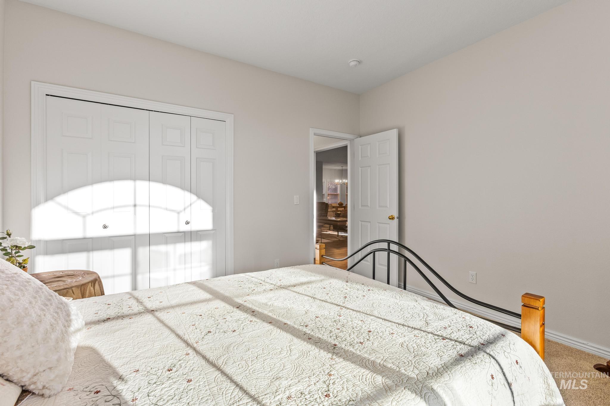Bedroom featuring a closet and carpet flooring