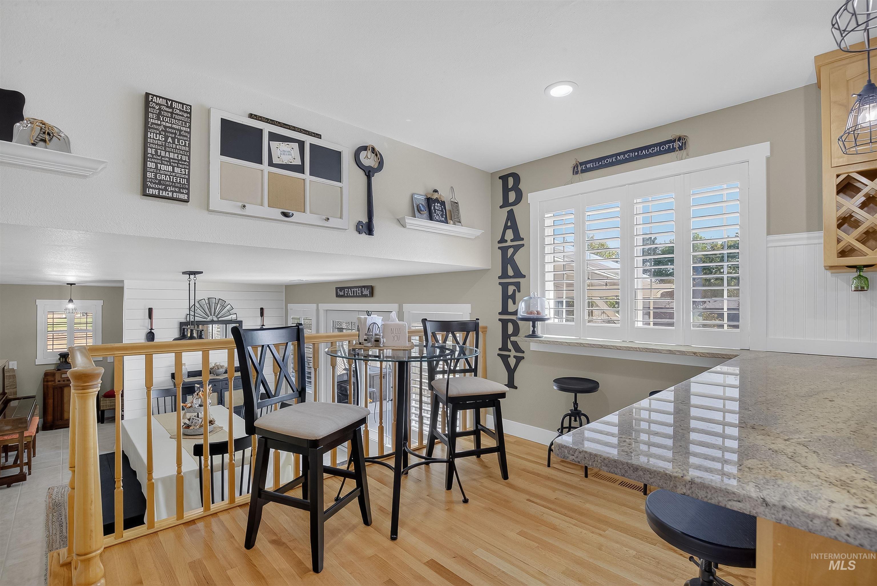 Dining room featuring light wood-style flooring and recessed lighting
