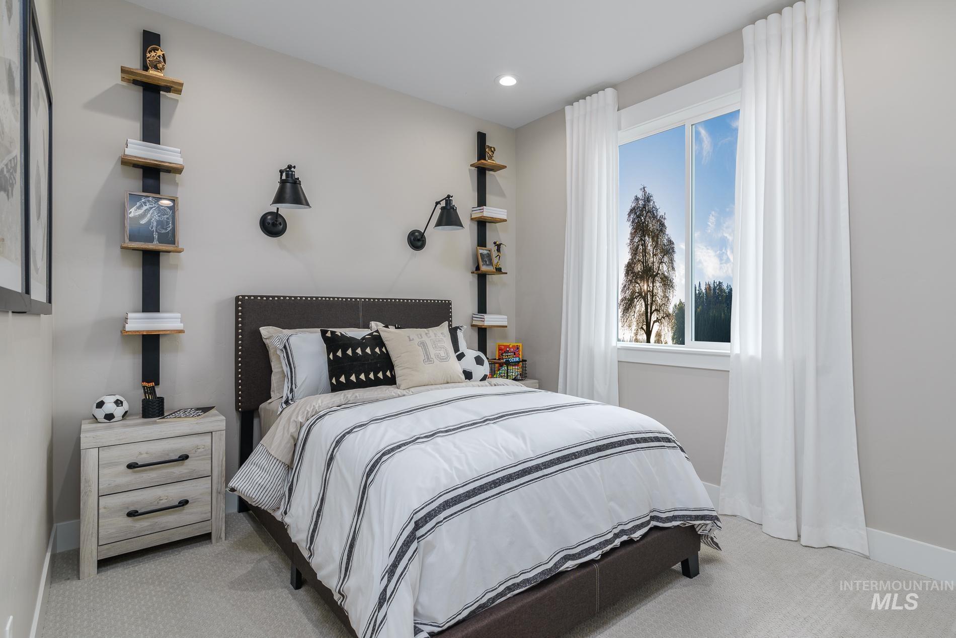 Bedroom with light colored carpet and recessed lighting