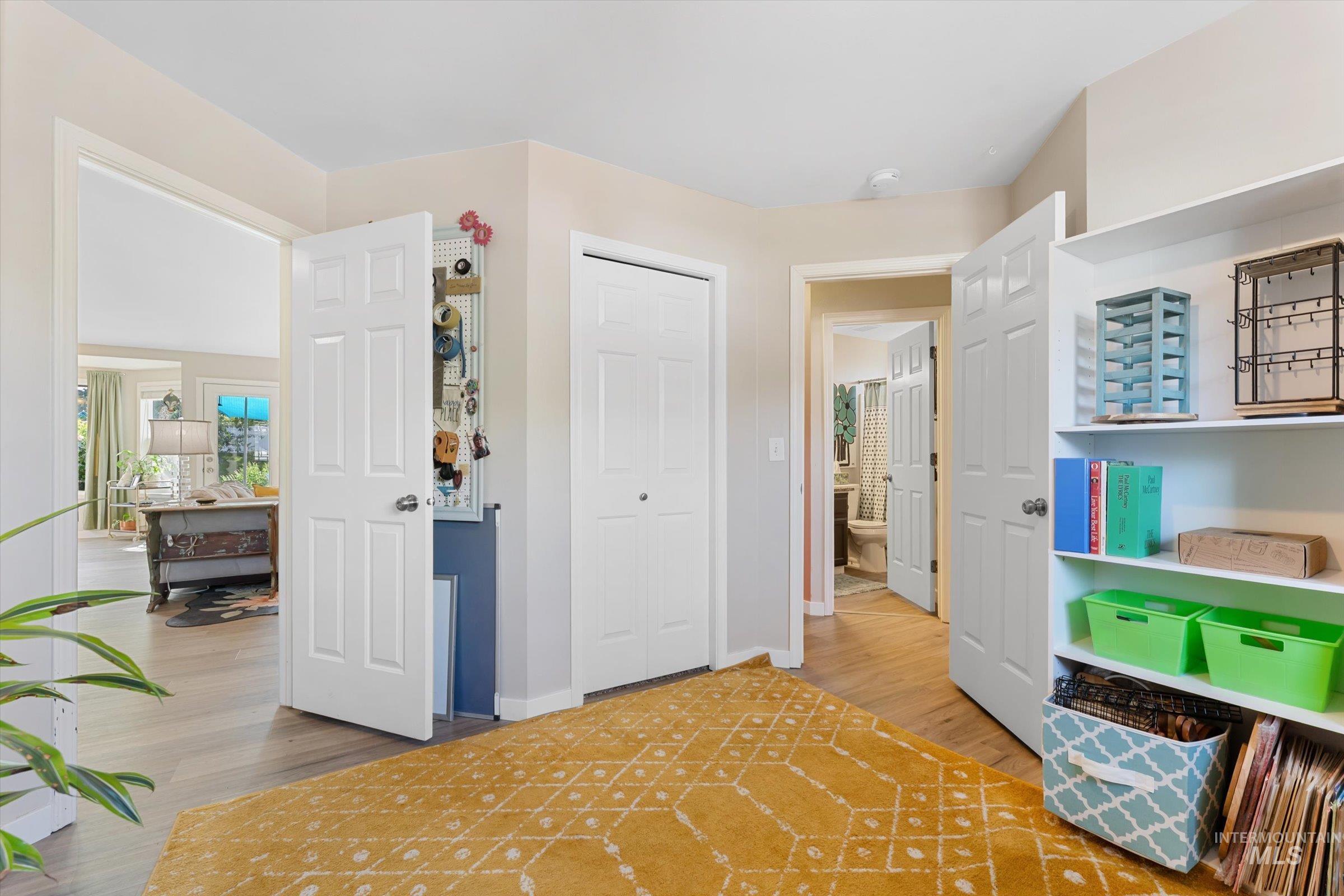 Bedroom featuring a closet and light wood finished floors