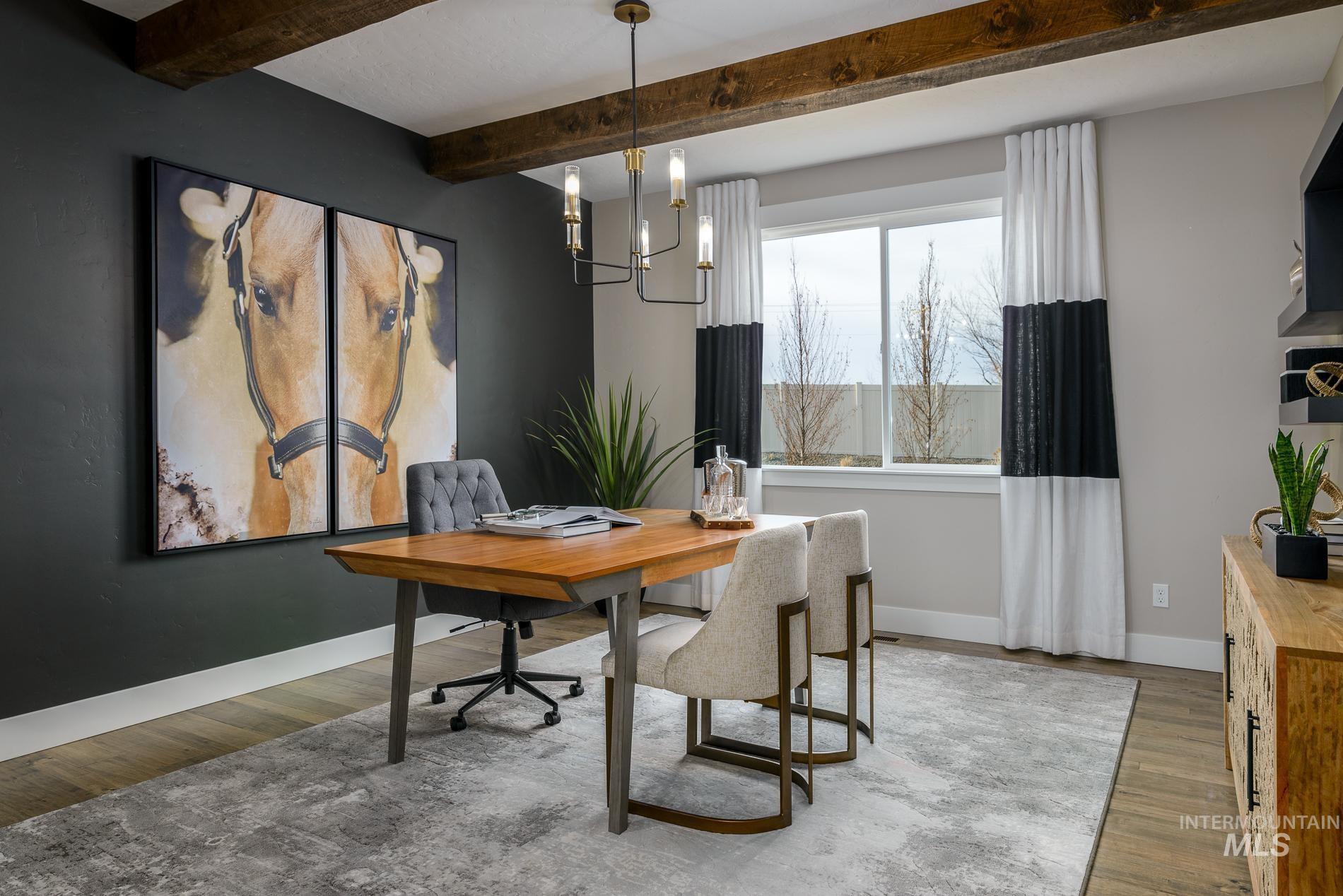 Office space with a chandelier, wood finished floors, and beamed ceiling
