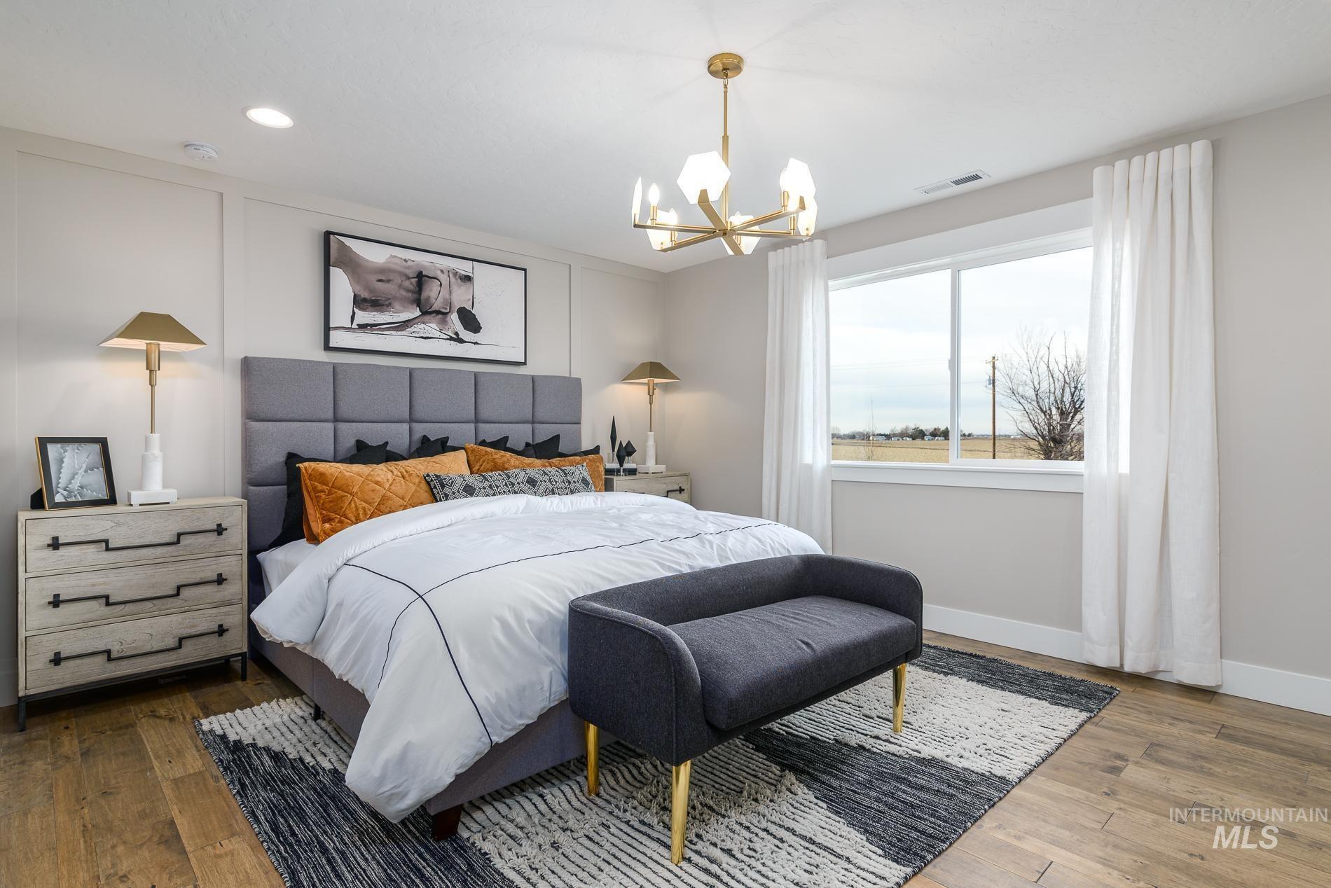 Bedroom with a chandelier, hardwood / wood-style flooring, and recessed lighting
