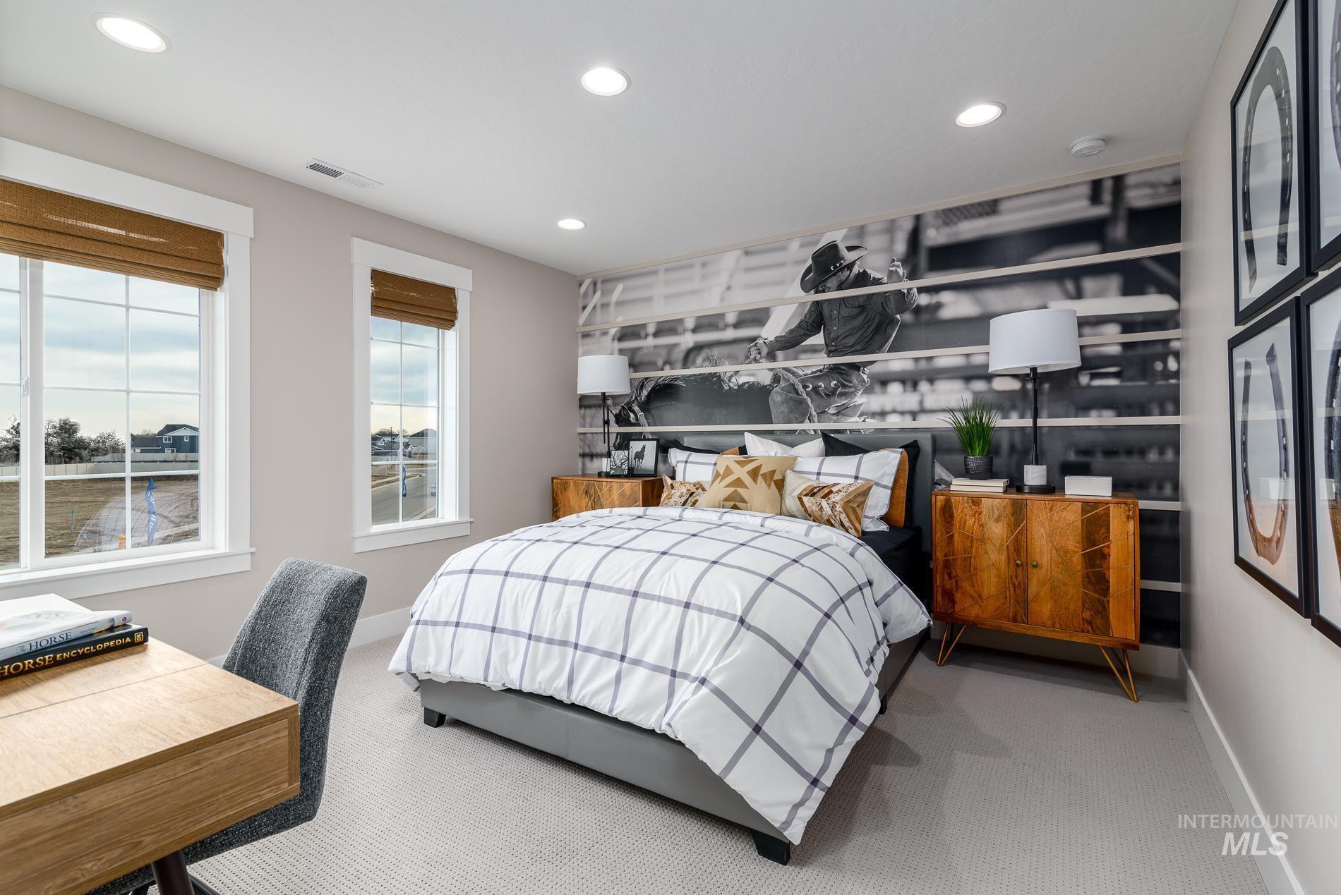 Carpeted bedroom with recessed lighting and baseboards