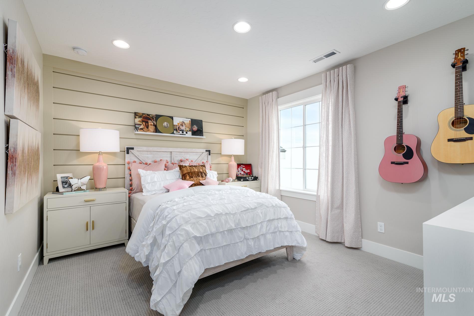 Bedroom with light carpet and recessed lighting