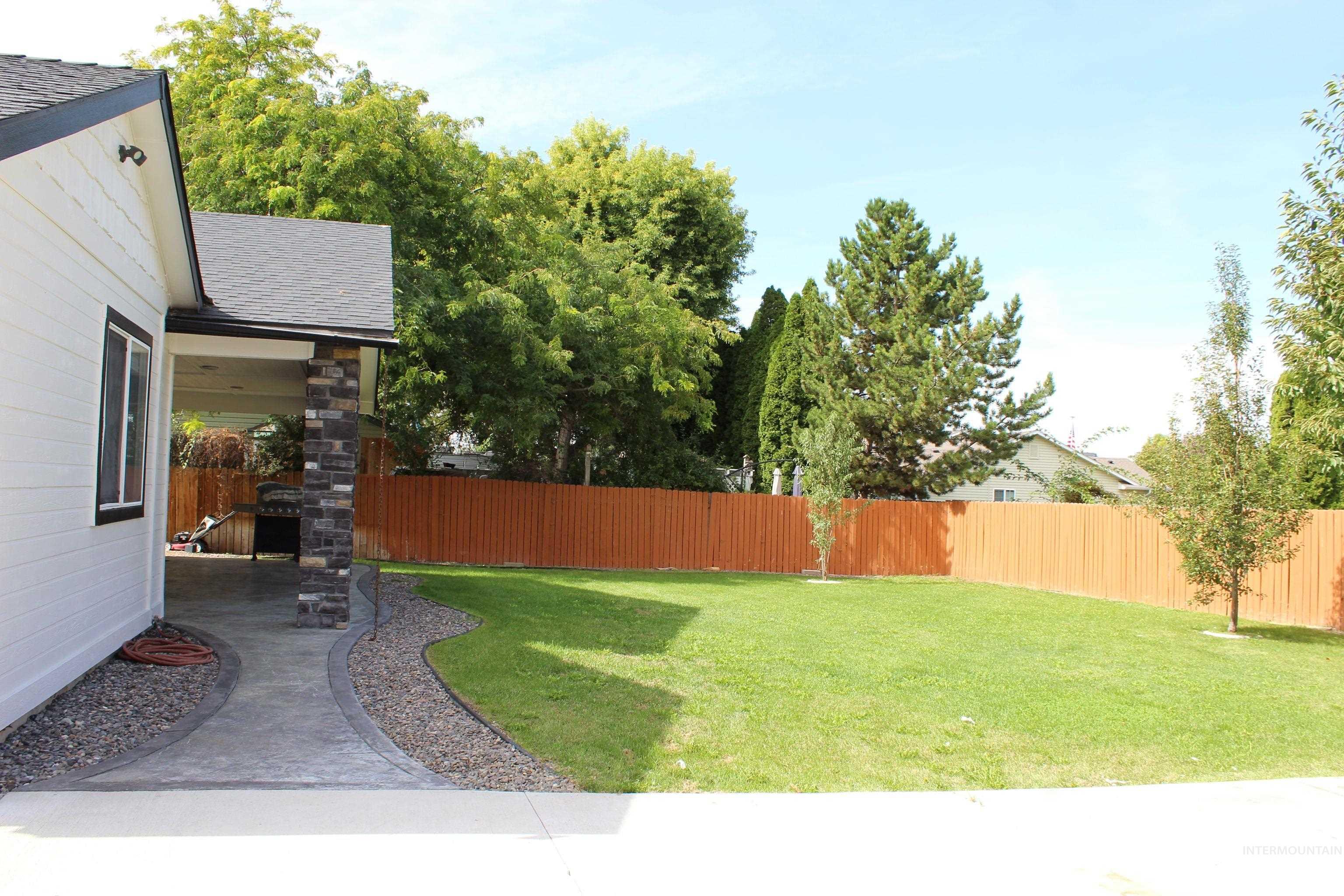Fenced backyard featuring a patio area