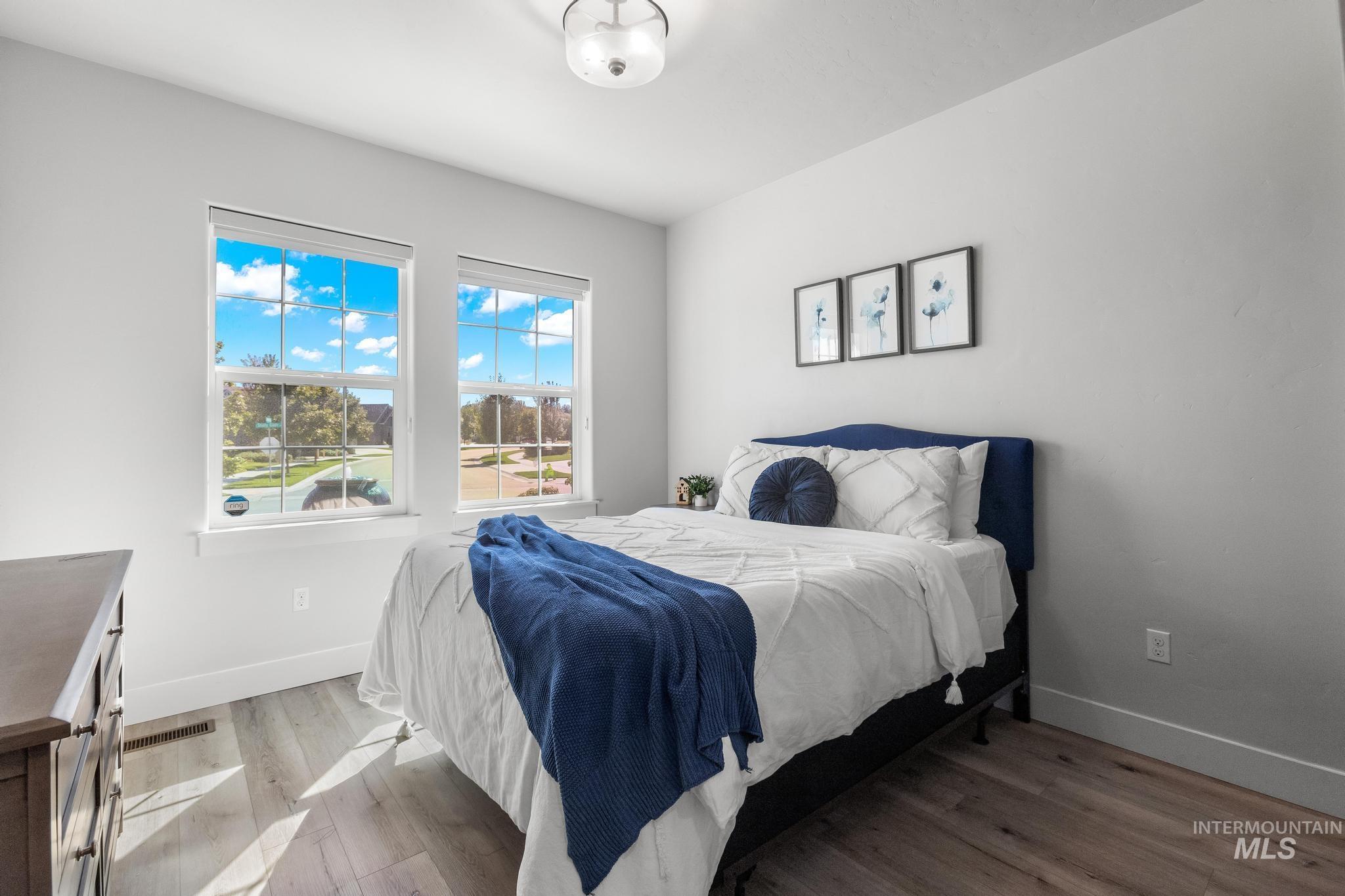 Bedroom featuring baseboards and light wood-style flooring