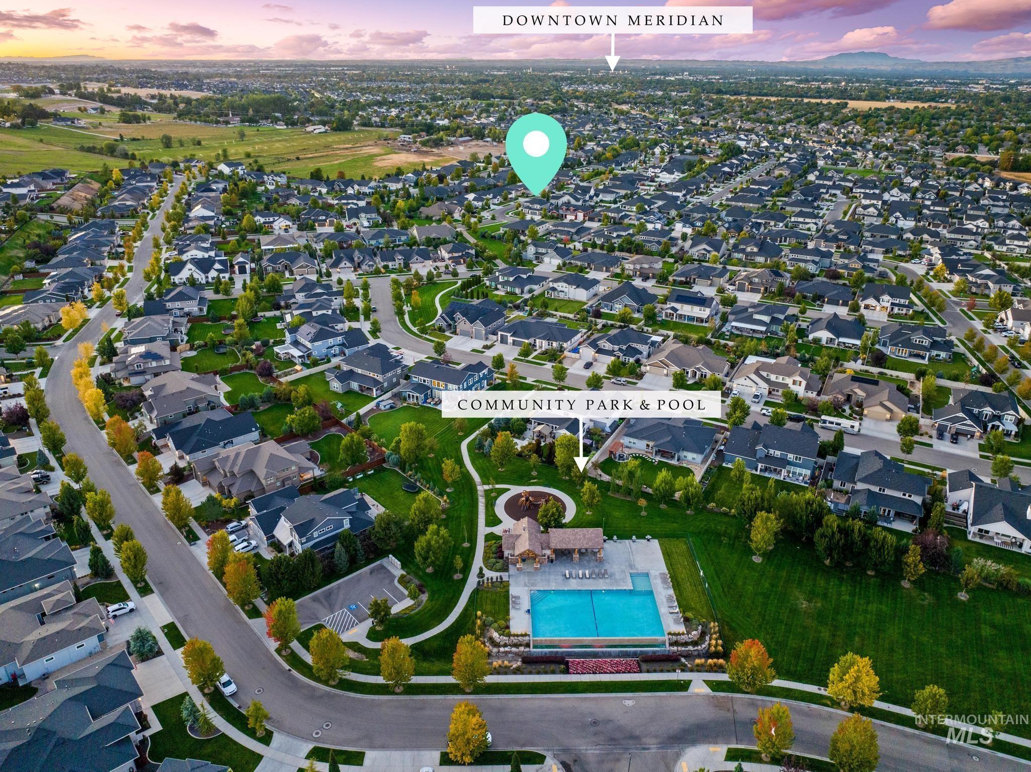 Aerial overview of property's location with a pool and nearby suburban area