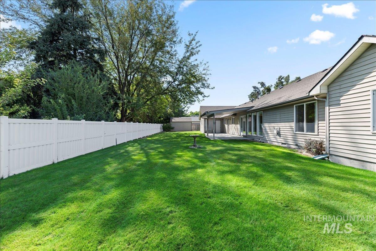 Fenced backyard featuring a patio area