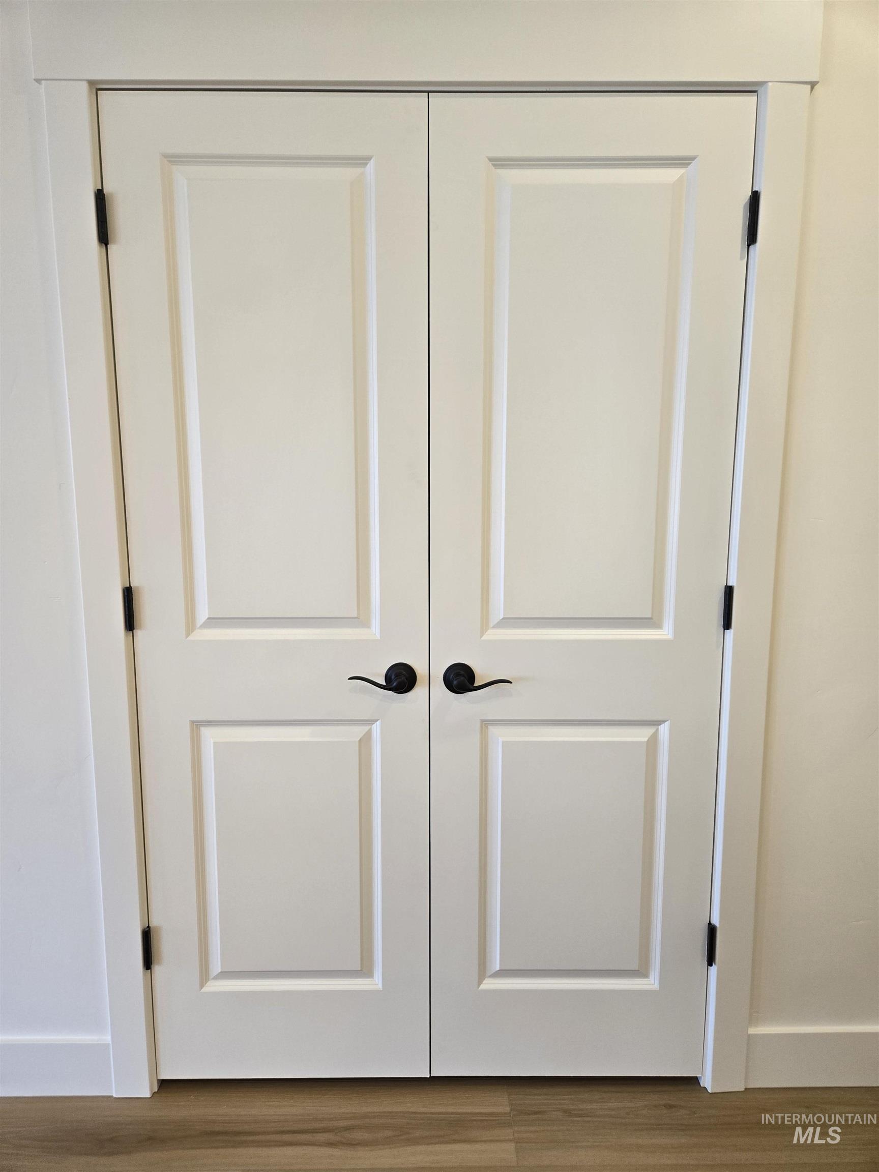 Detailed view of baseboards and wood finished floors