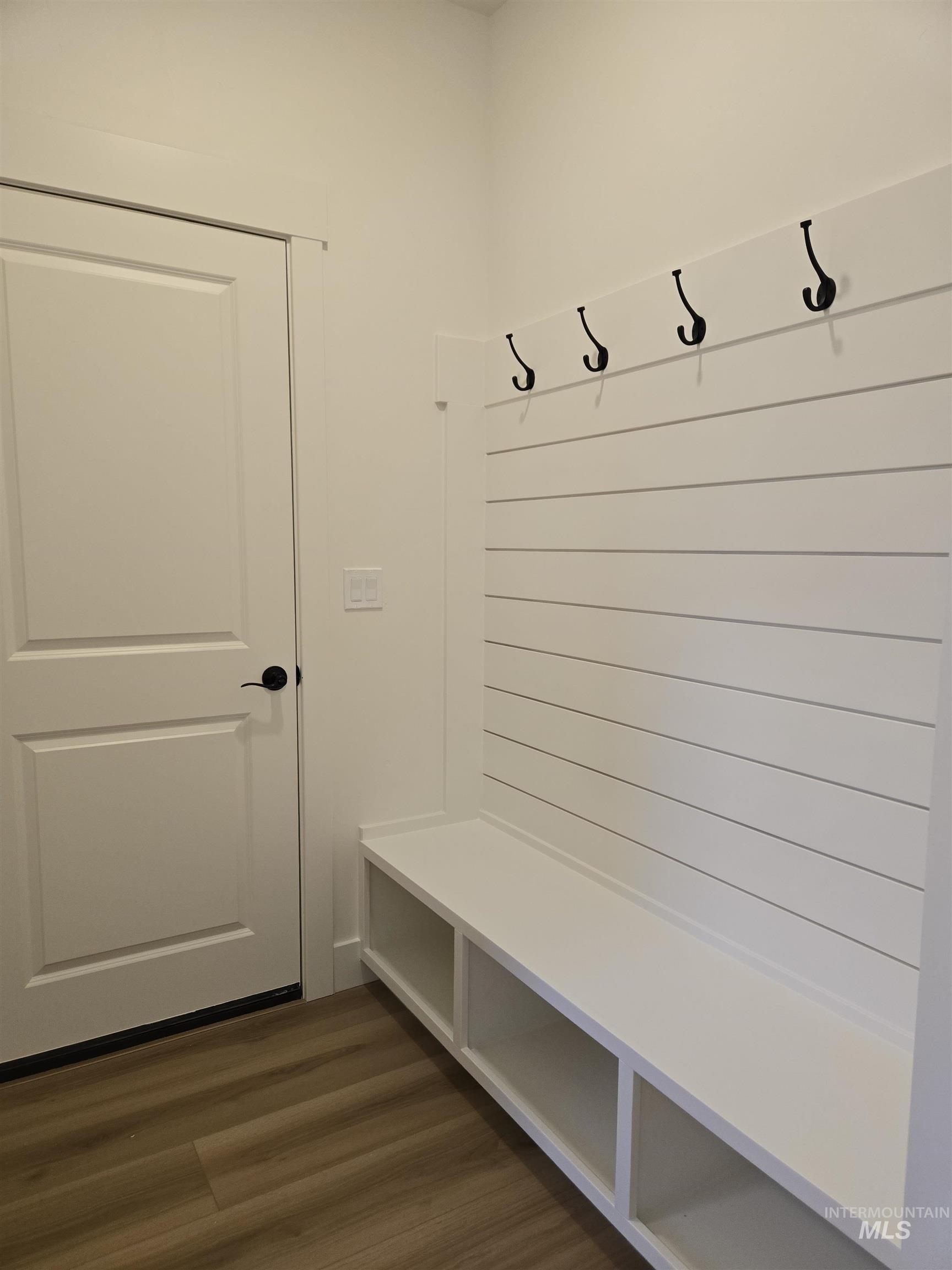 Mudroom featuring dark wood-style flooring