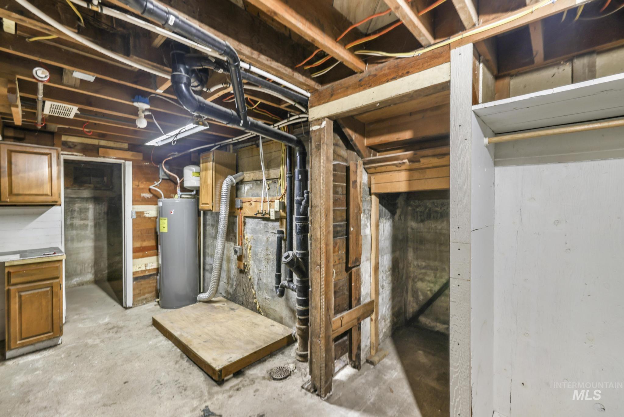 Unfinished basement with electric water heater