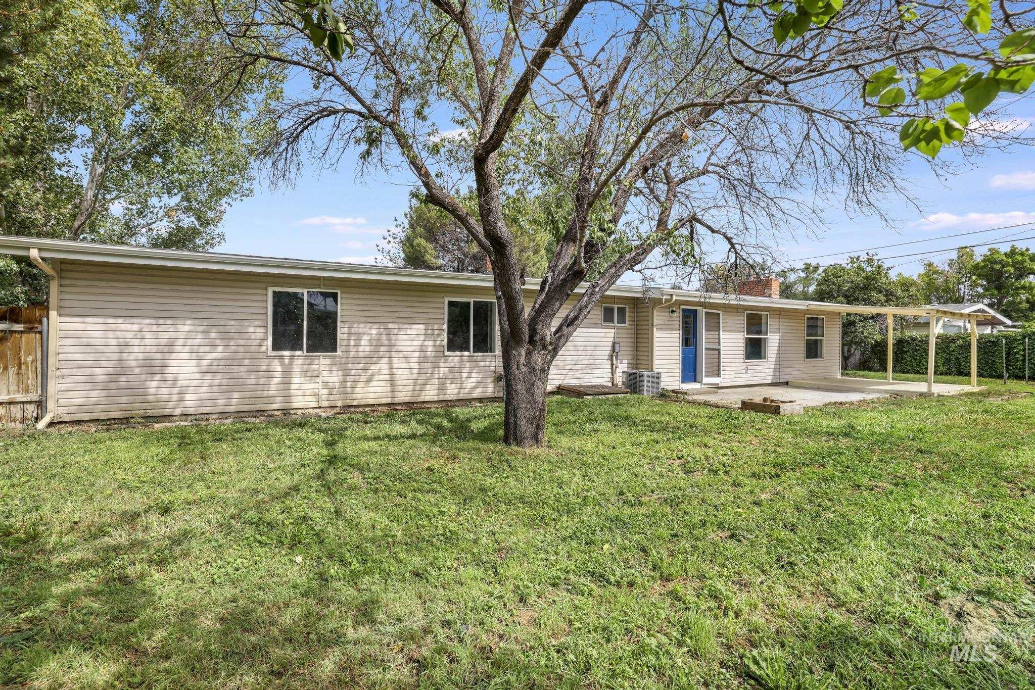 Rear view of property with a patio area and a chimney