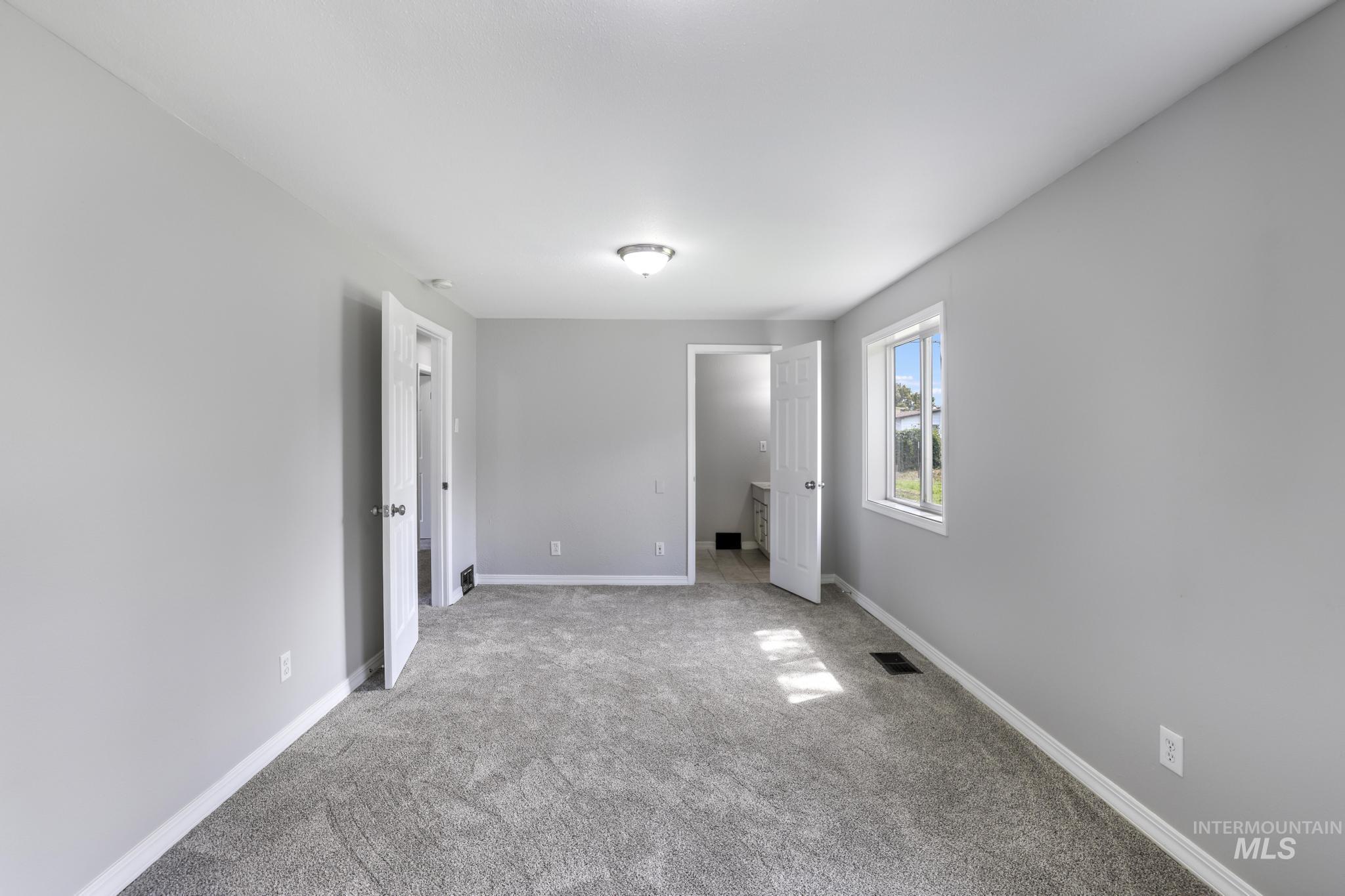 Unfurnished bedroom featuring carpet
