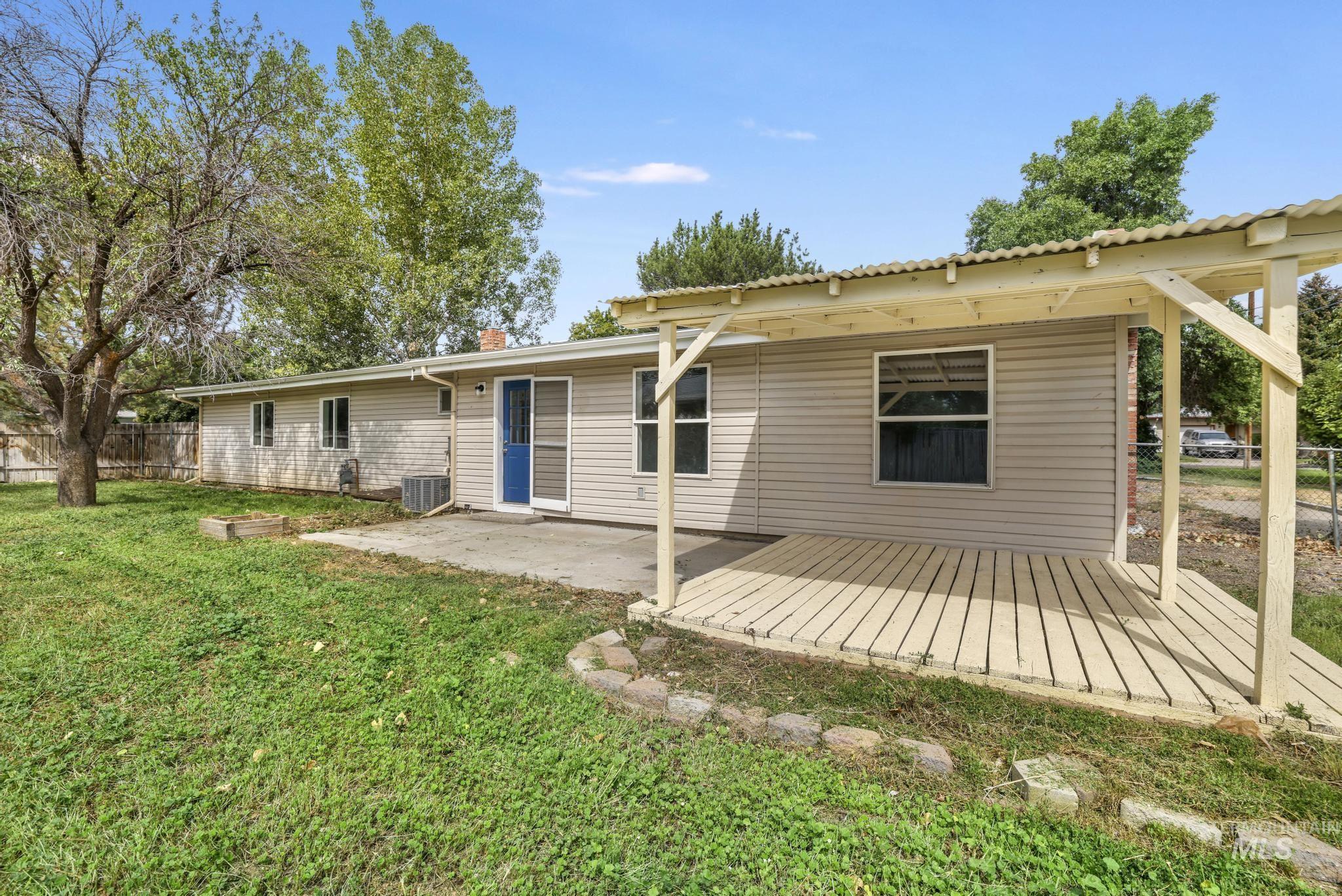 Rear view of property featuring a patio area and a chimney