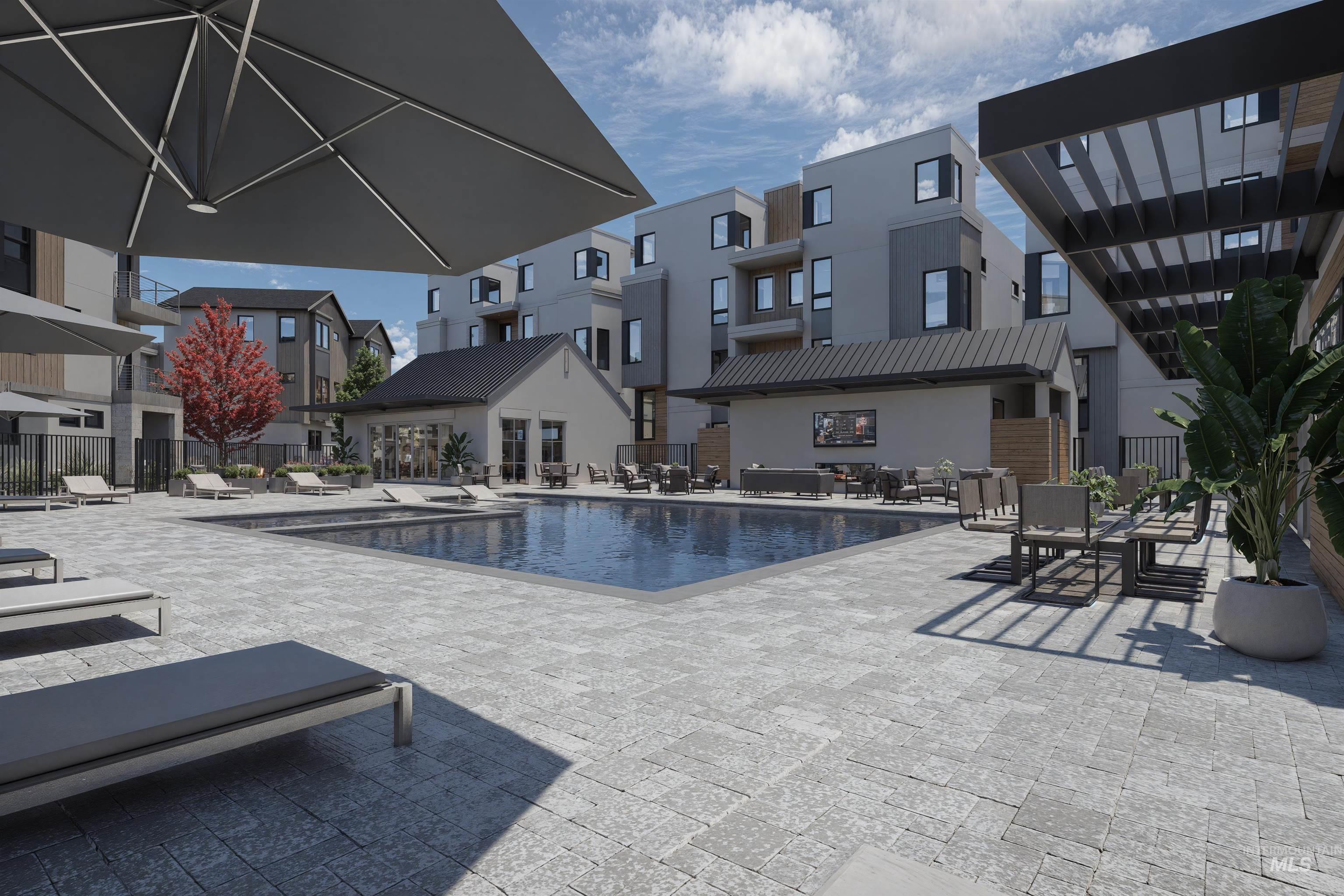 Community pool with a patio