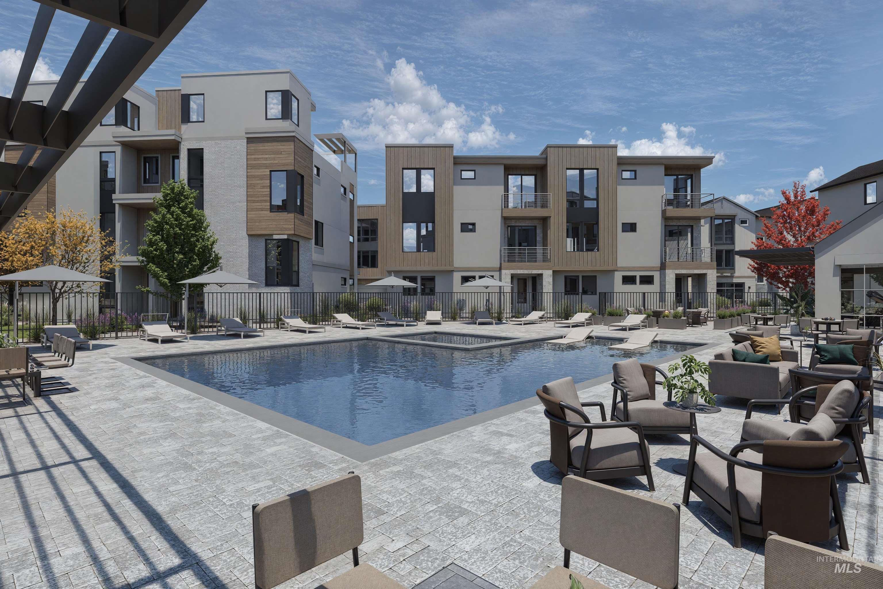 Community pool with a patio area and a gazebo