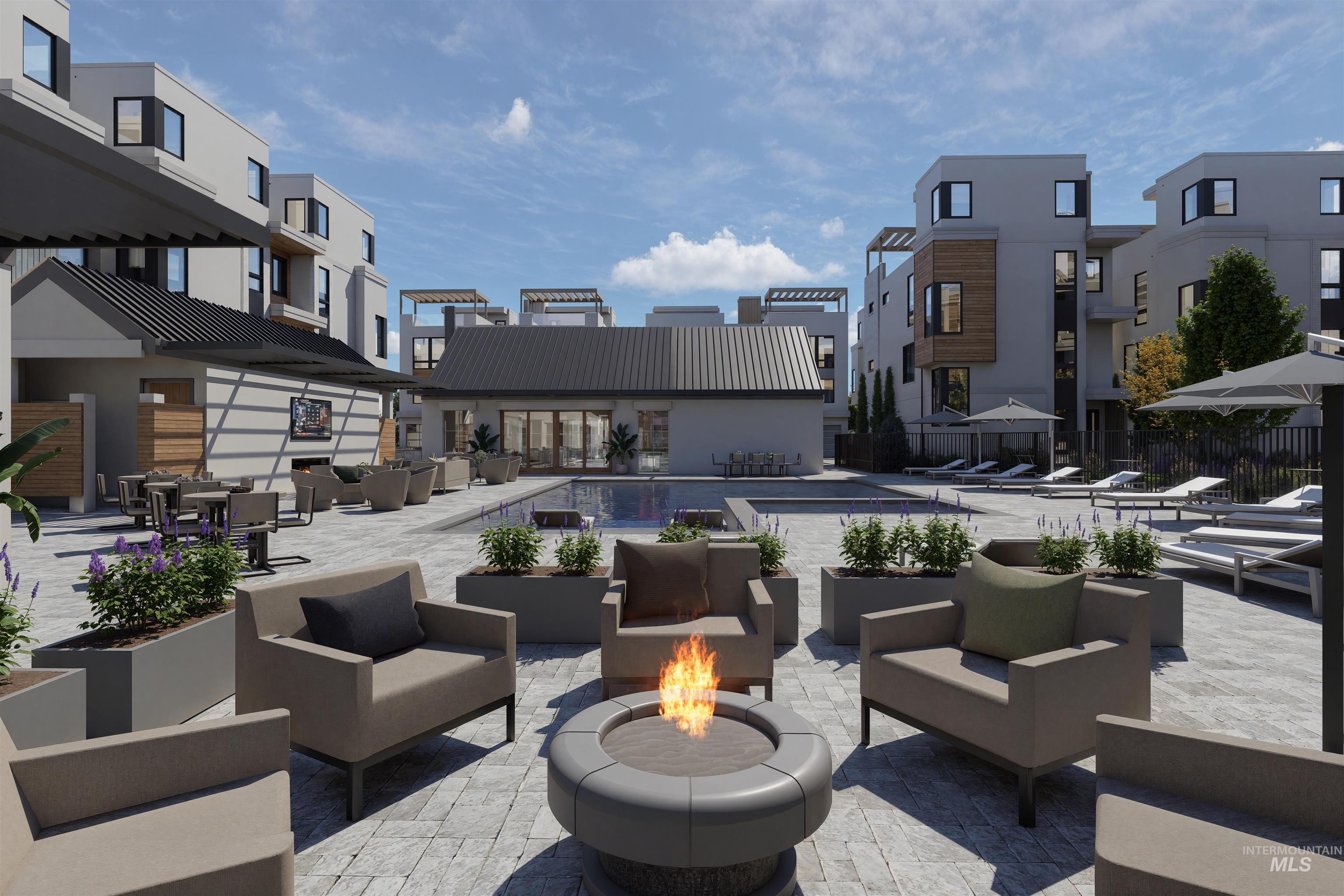 View of patio / terrace featuring an outdoor living space with a fire pit, a community pool, and a residential view