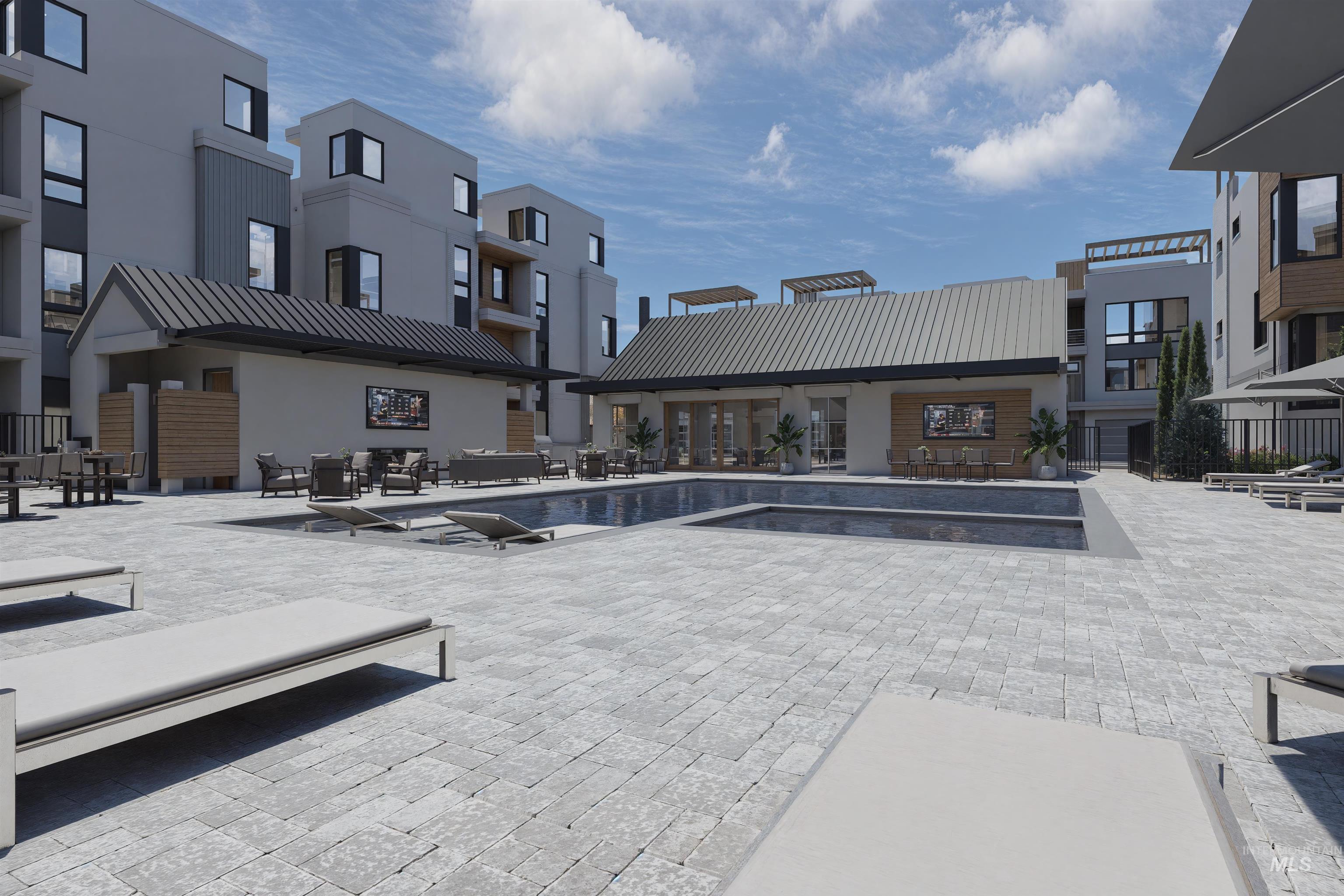 Community pool featuring a patio
