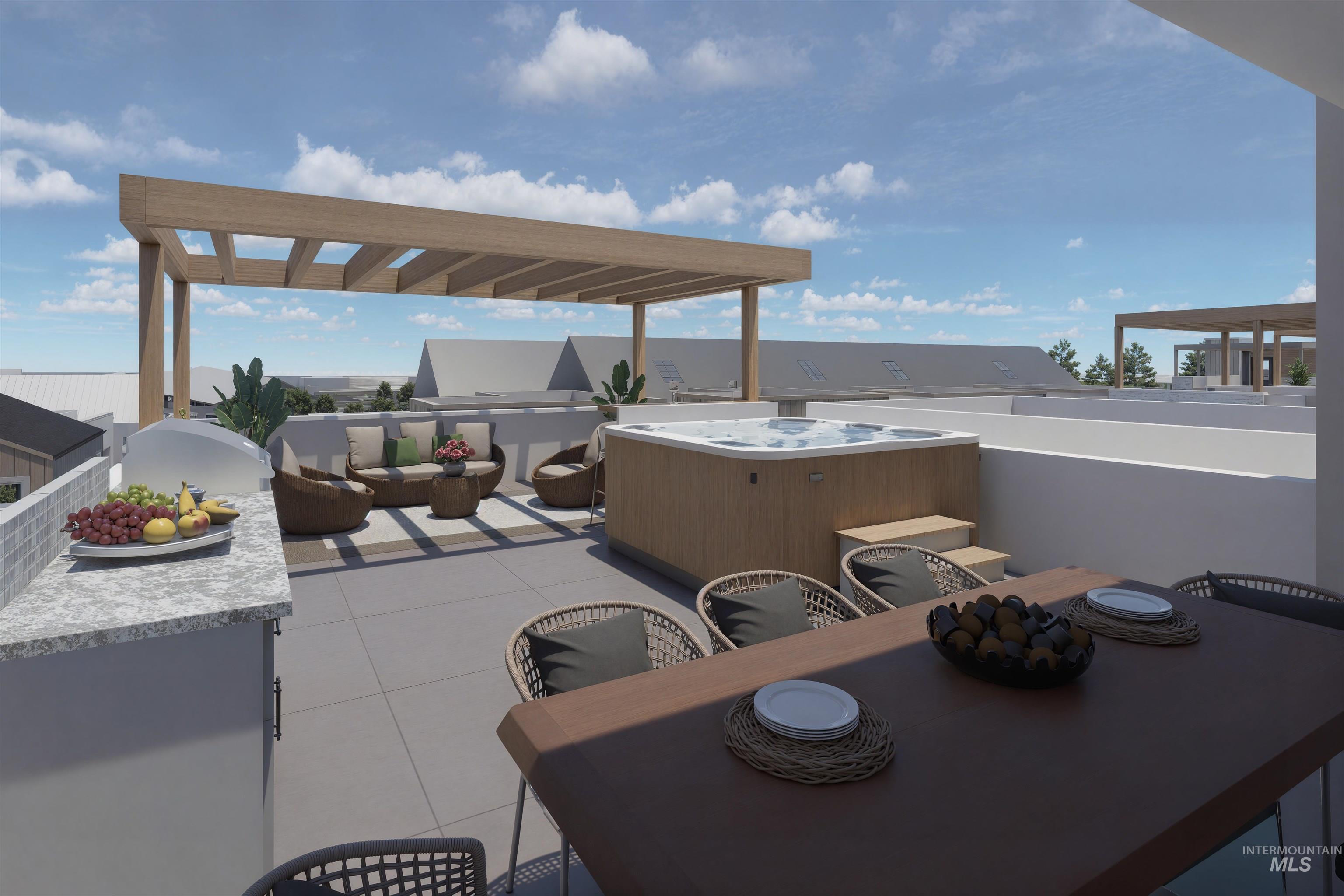 View of patio / terrace featuring outdoor dining area and a hot tub